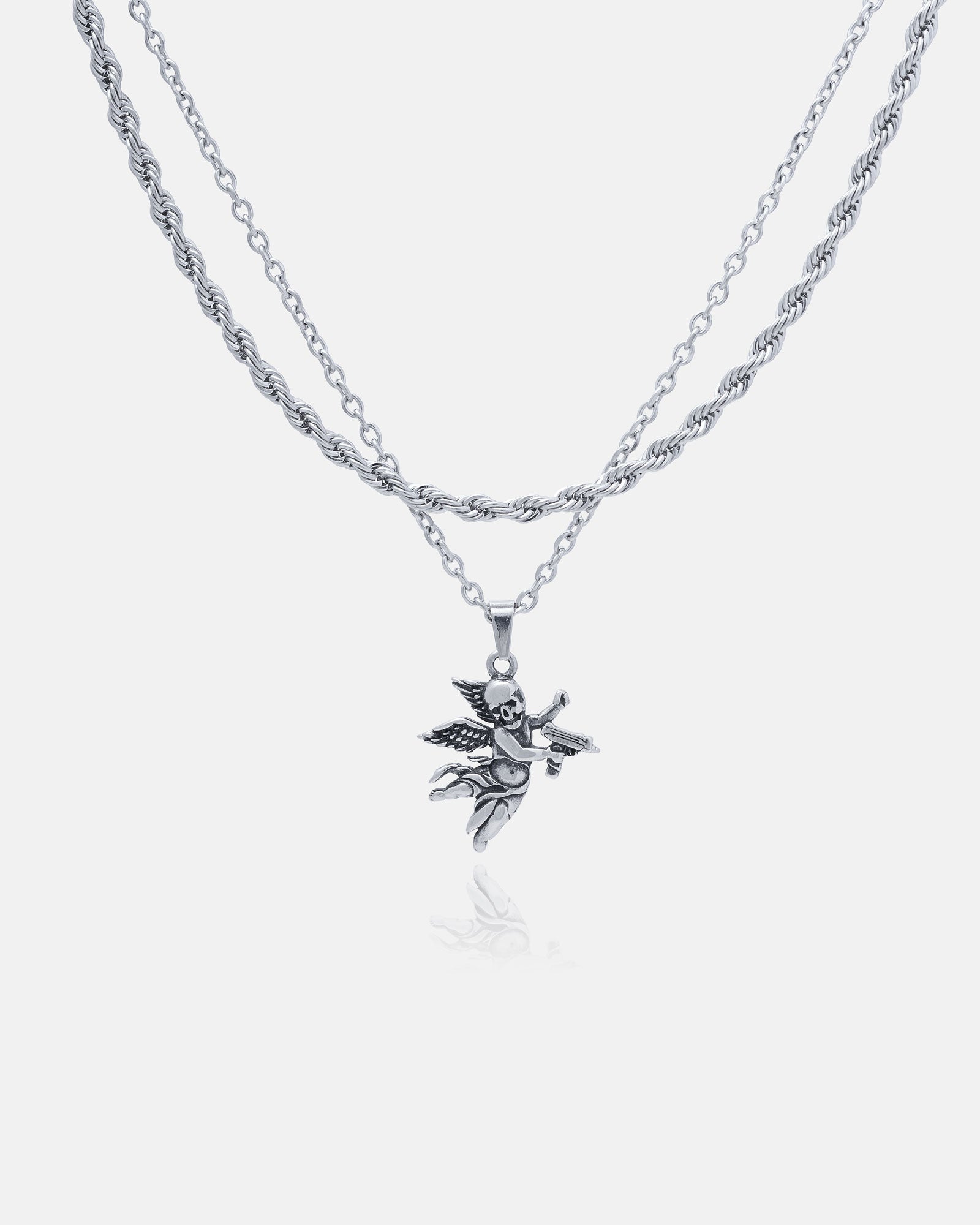 The Statement Collective Rope Set features a silver double-chain necklace with a custom pendant choice, shown here as a detailed angel holding a star. Stainless steel, hypoallergenic, and set against a white background for contrast.