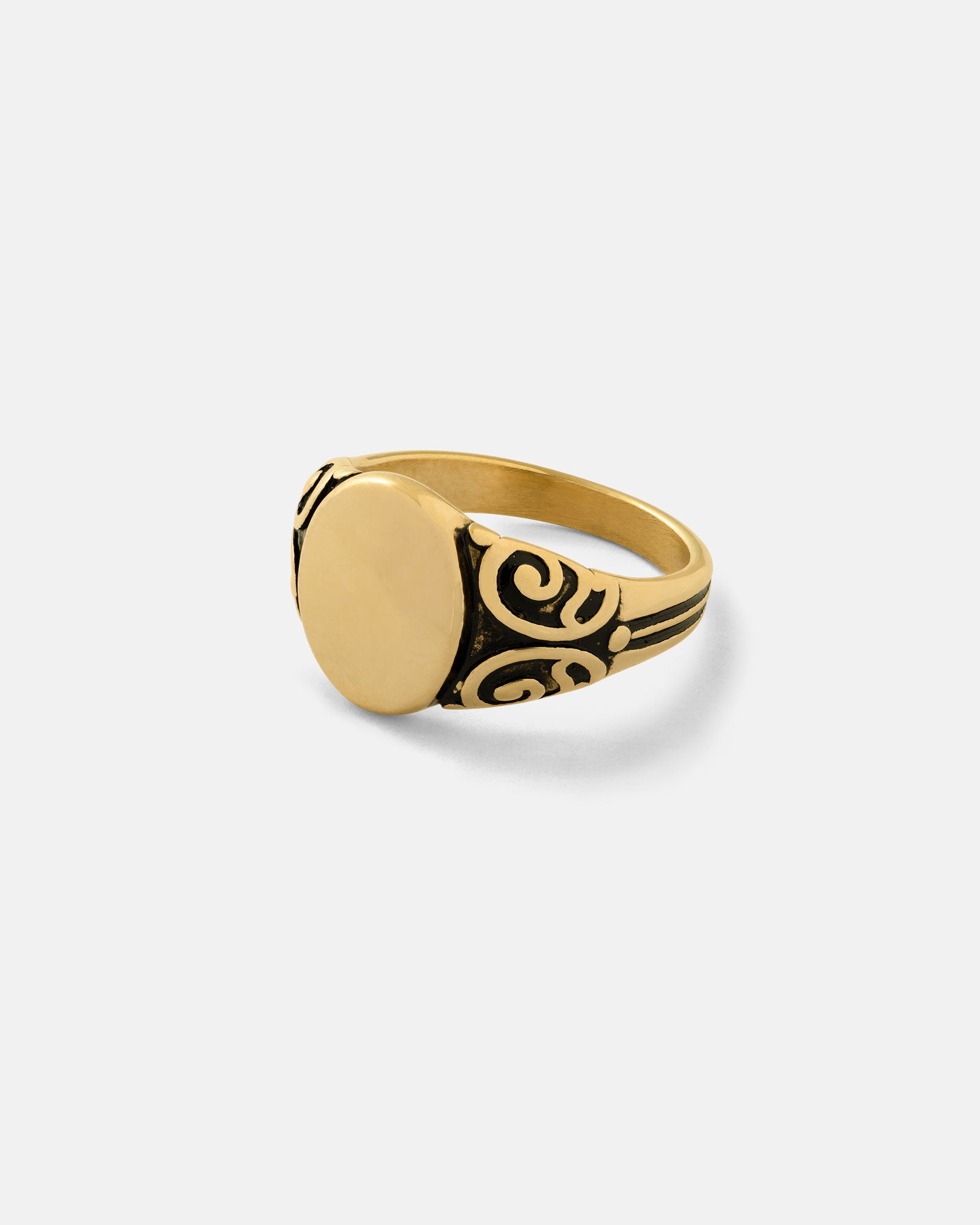 The Mini Oval Scroll Signet Ring (Gold) is an 18k gold pinkie ring with a smooth, oval face and detailed black scrollwork on the band, shown against a plain white background.
