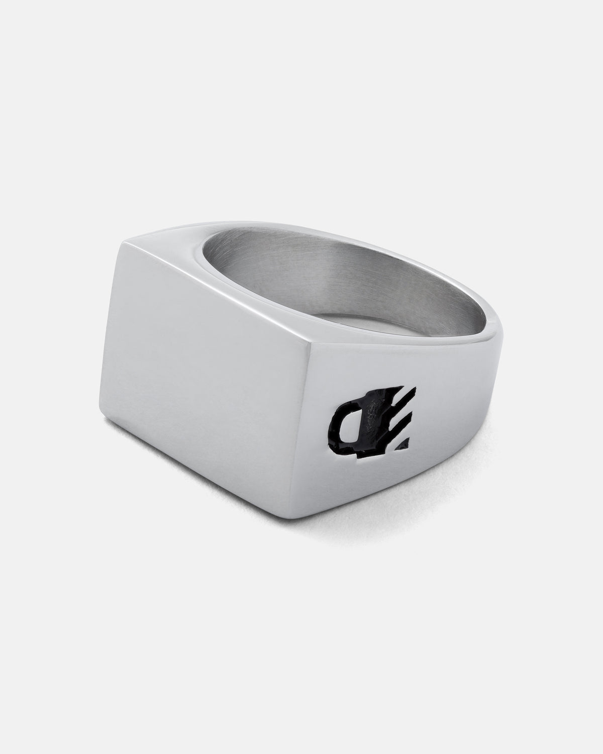Minimalist Statement Signet Ring in stainless steel with a flat rectangular face and a cutout logo on the side.