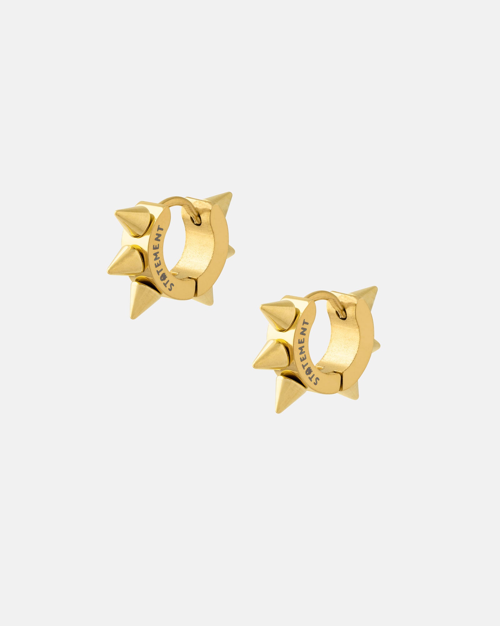 6mm Spiked Hoop Earrings (Gold): 18k gold huggie hoops featuring three pointed spikes and "STATEMENT" engraved on each side, displayed on a plain light grey background.