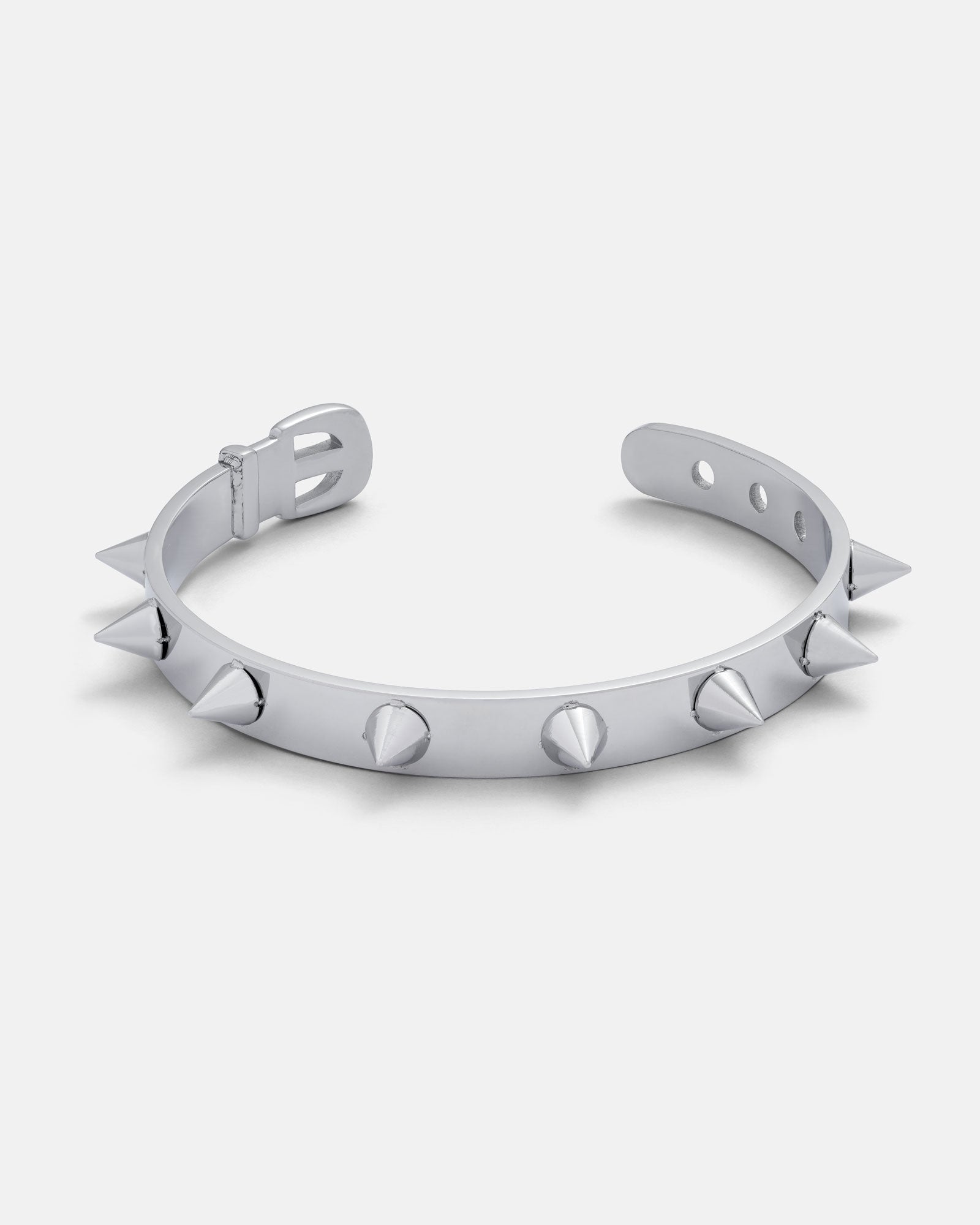 Silver Spiked dog collar cuff bracelet by statement collective on grey background