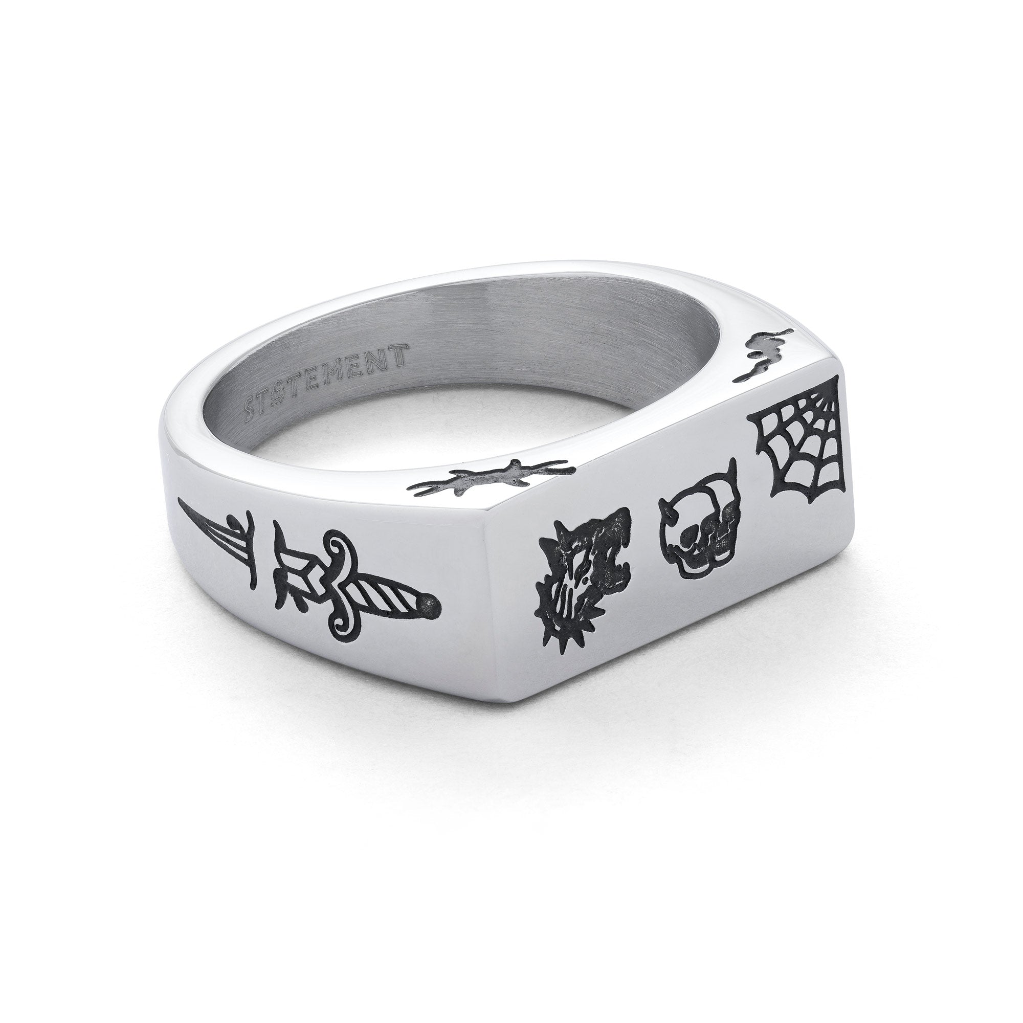 Silver signet ring, rectangular shaped with traditional style tattoo details including skulls, spider webs, barbed wire and a dagger on the side