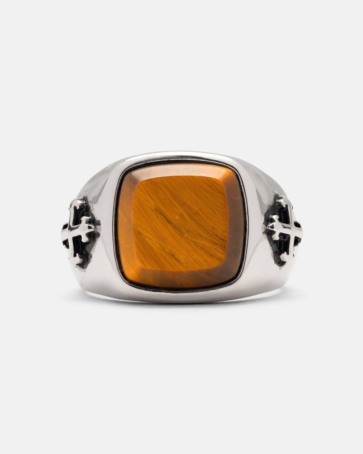 Statement Collective Tigers Eye Stone Ring featuring a rectangular tiger’s eye stone and cross emblems on the sides of a stainless steel band.