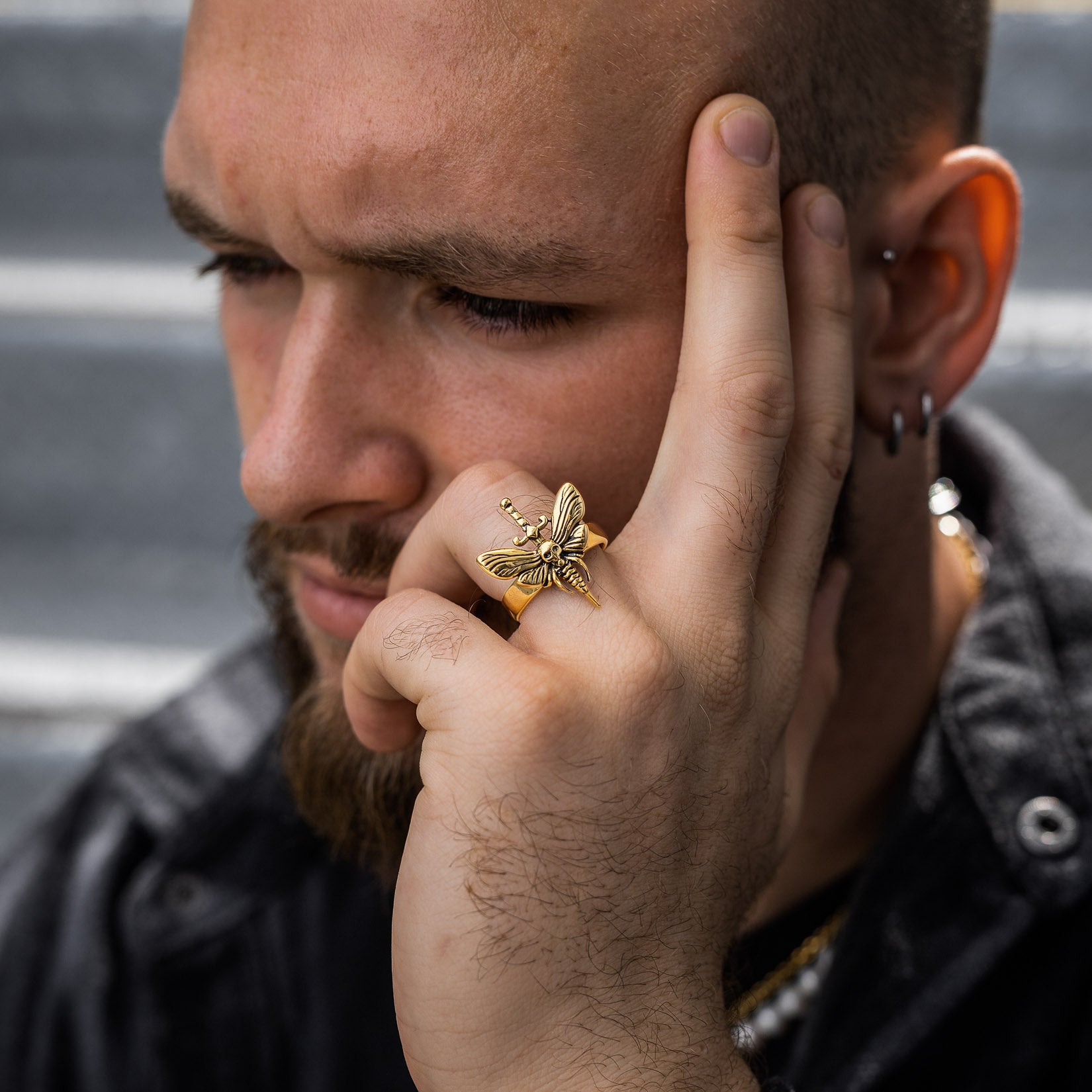 moth ring in gold on model's hand