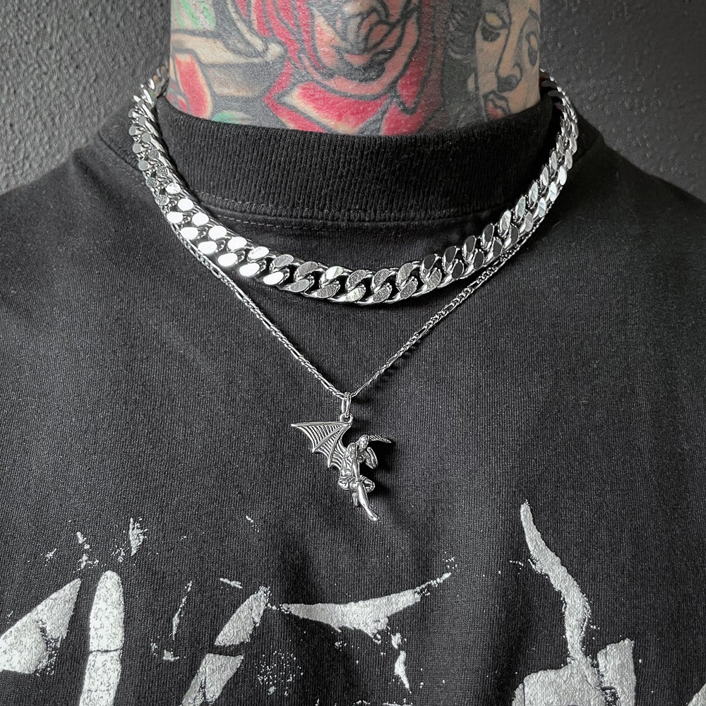 man with black shirt wearing fallen angel pendant and thick cuban chain