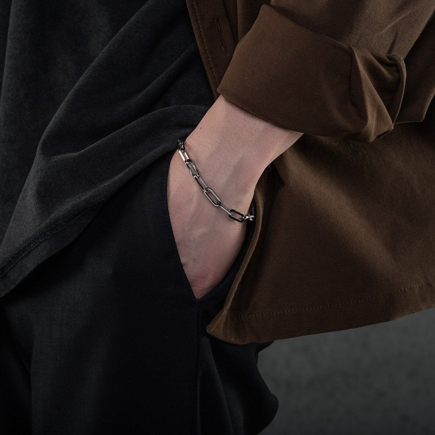 mens hand with 6mm paperclip bracelet by statement collective