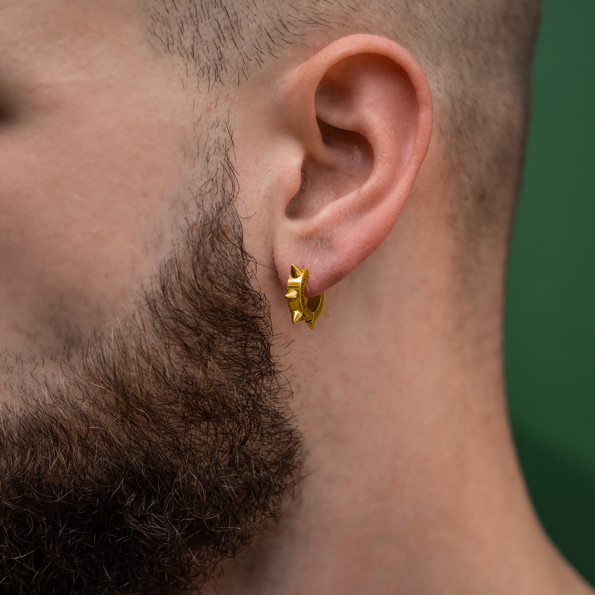 gold Spiked Hoop earring on male model