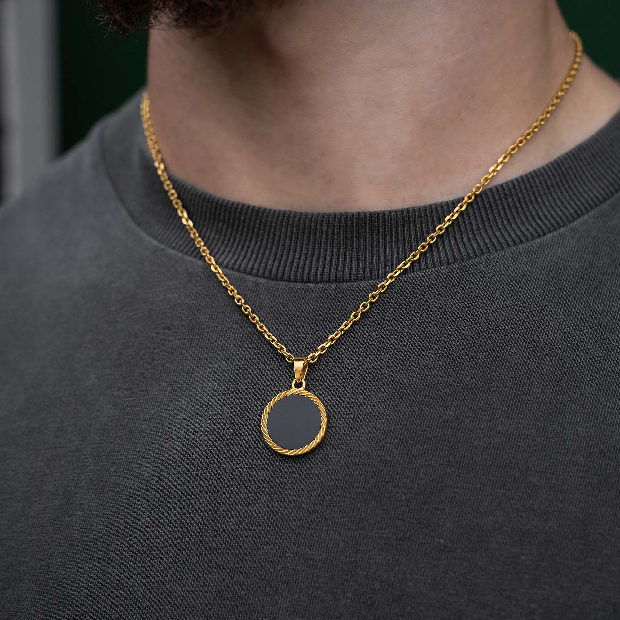 Circular Onyx Stone Pendant necklace in gold on body