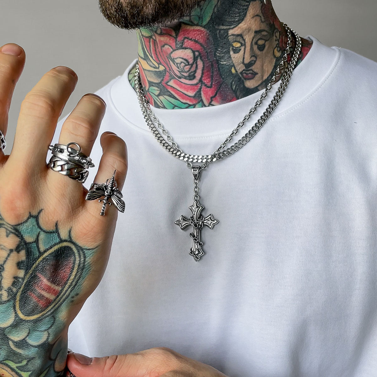 Silver cross pendant by statement collective