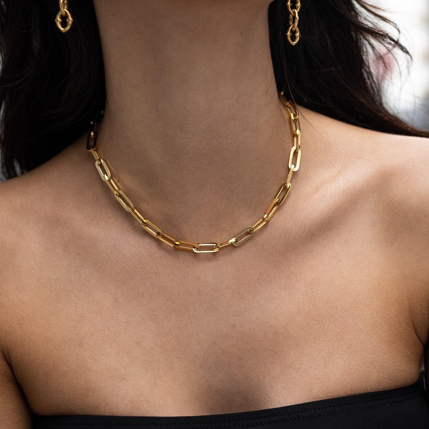Womens gold chain link necklace on model
