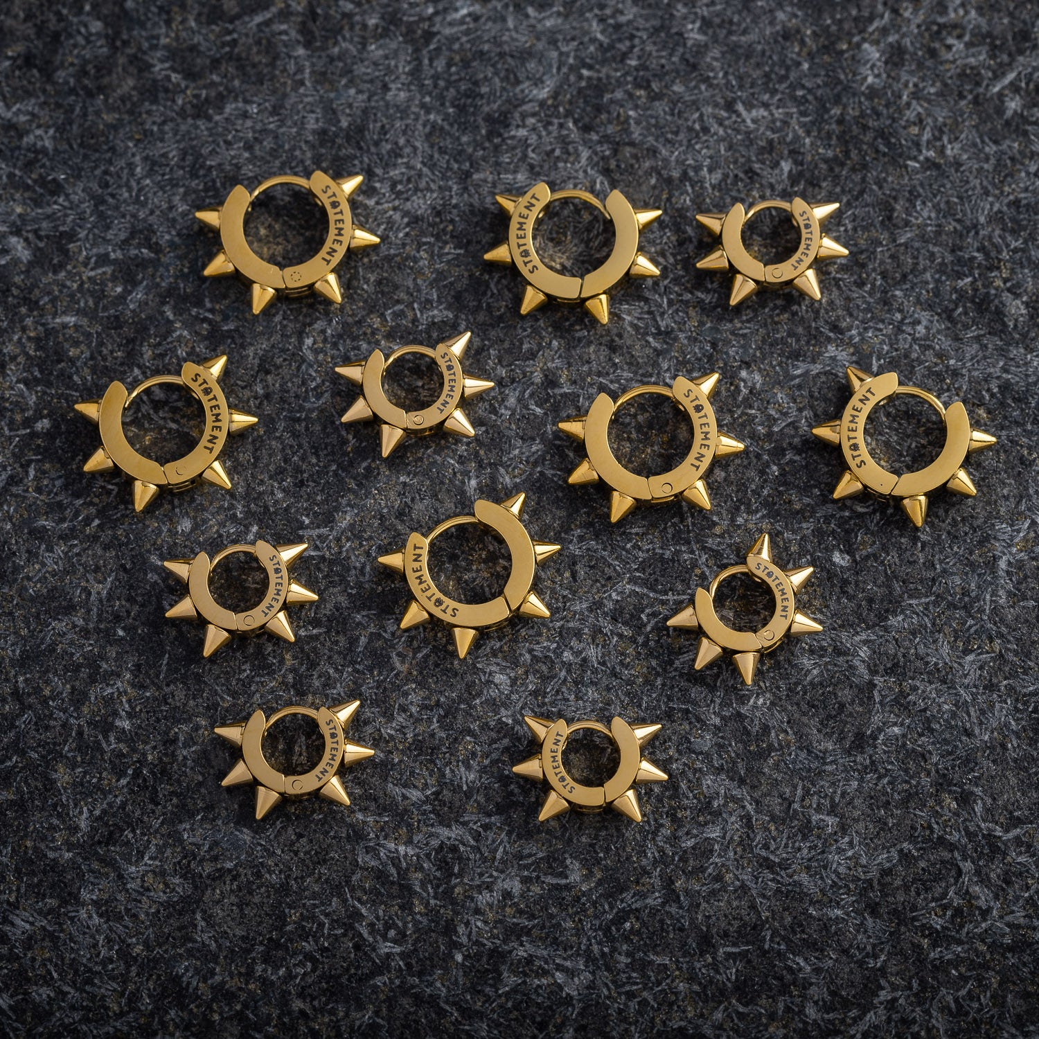 gold earrings by statement collective