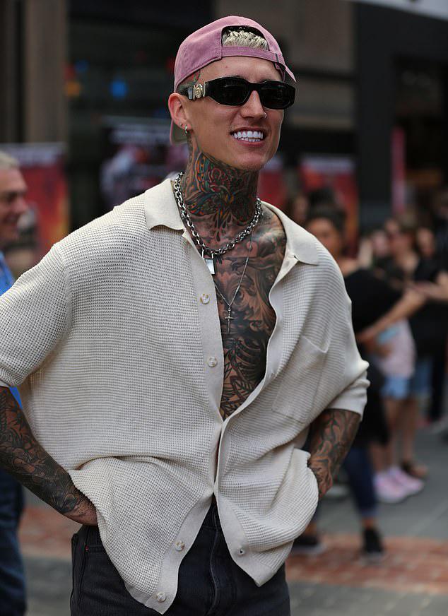 Batchelor in Paradise Star Ciarran Stott Spotted In The News Wearing Statement