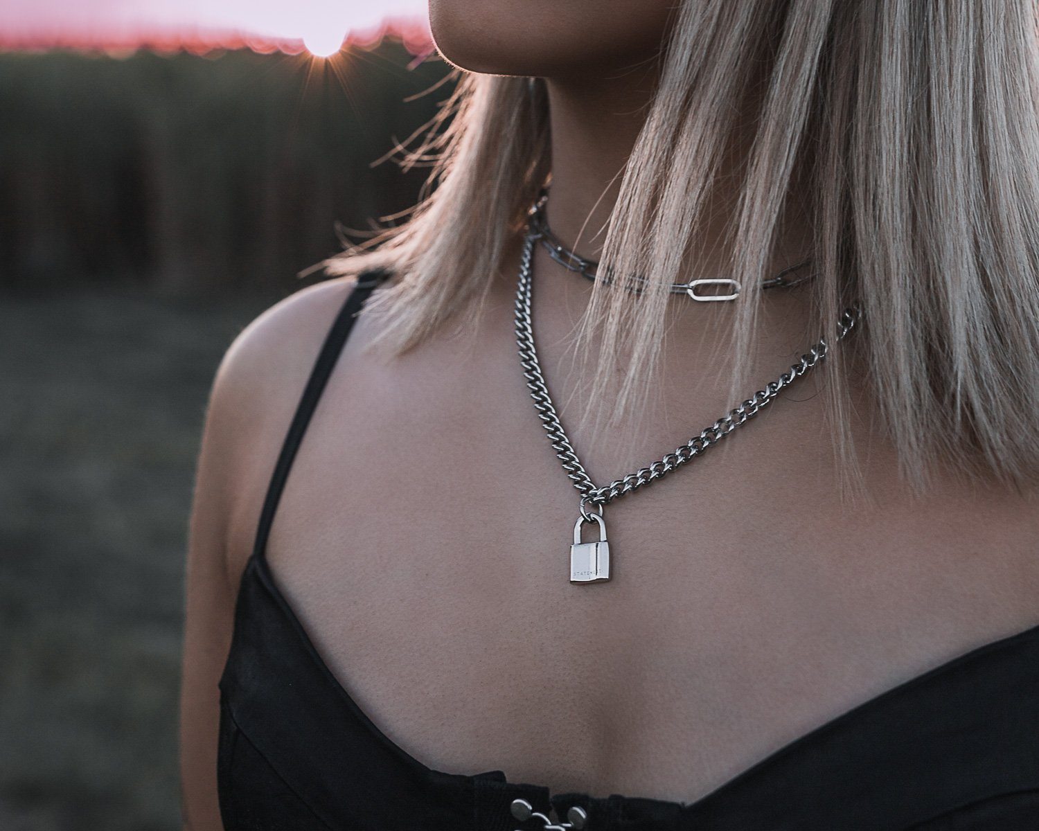 Black string necklace and oblong metal tag - knots