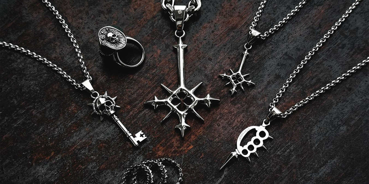 2024 design competition jewelry pieces displayed on dark wood background