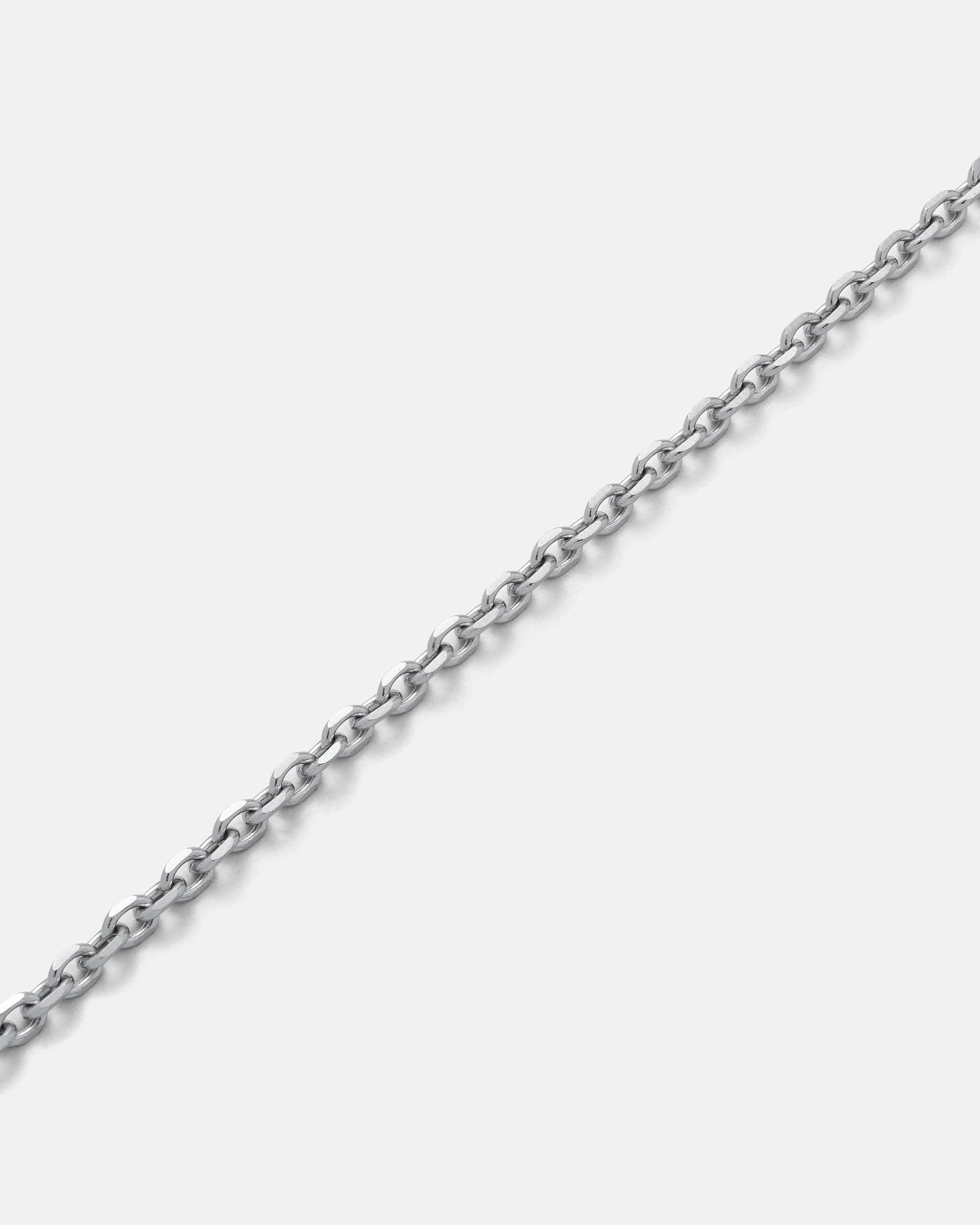 The 3mm Cable Chain, made of thin, non-tarnish stainless steel with small round links, is shown diagonally against a light gray background.