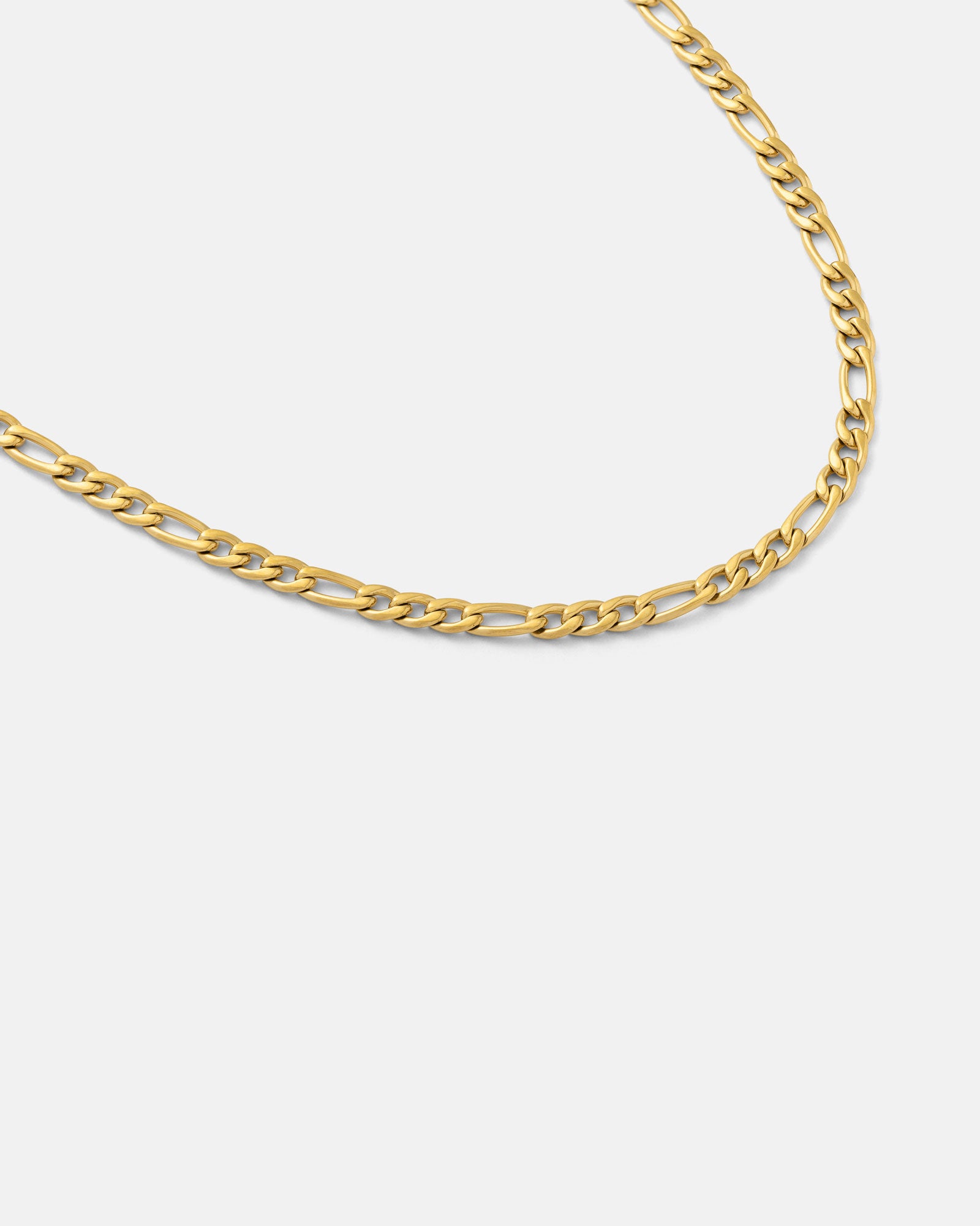 A close-up of the 2.9mm Figaro Chain (Gold), featuring elongated, flat links, displayed on a plain white background.