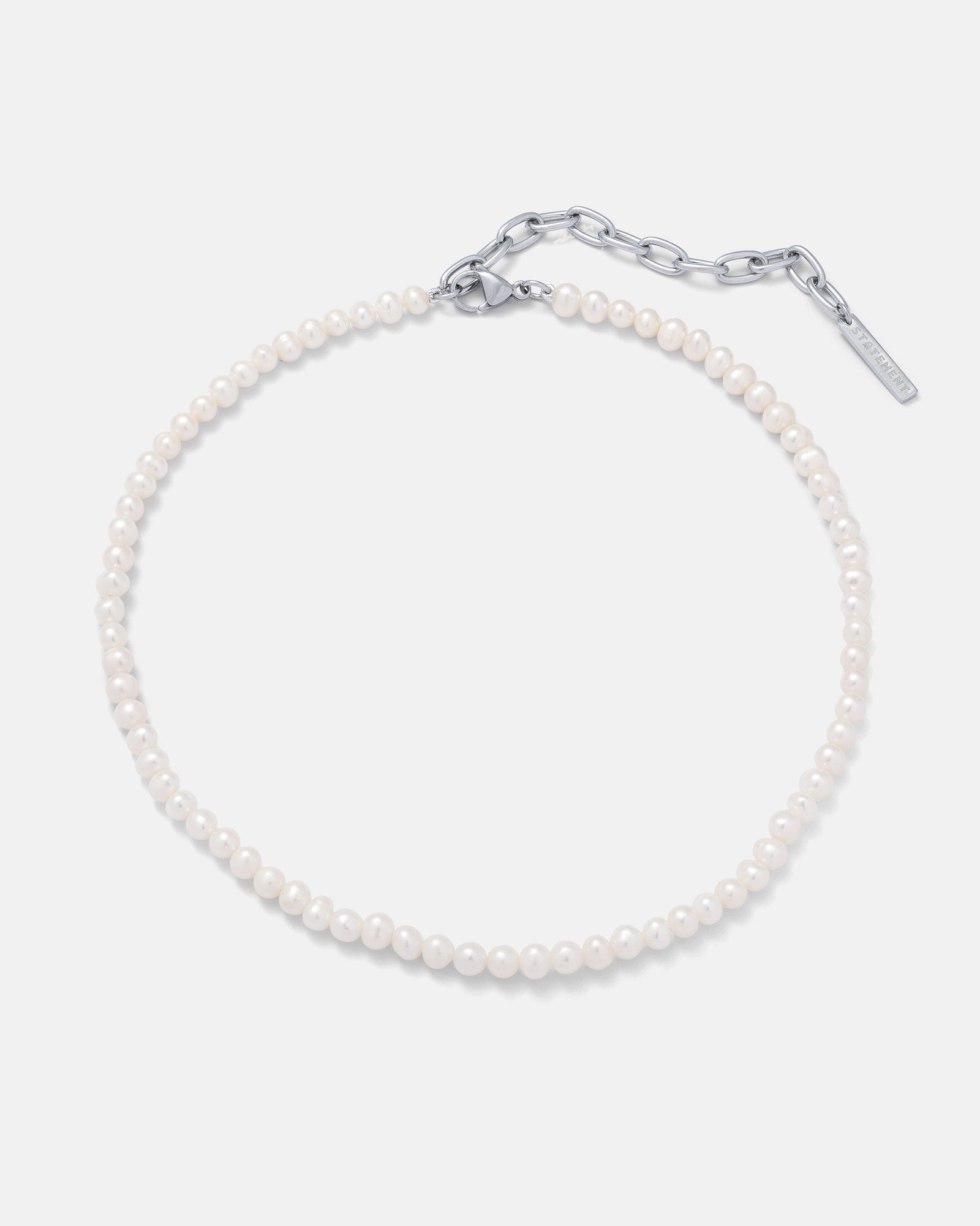 The 5mm Freshwater Pearl Necklace features small real freshwater pearls and a silver adjustable chain clasp, shown on a plain white background.