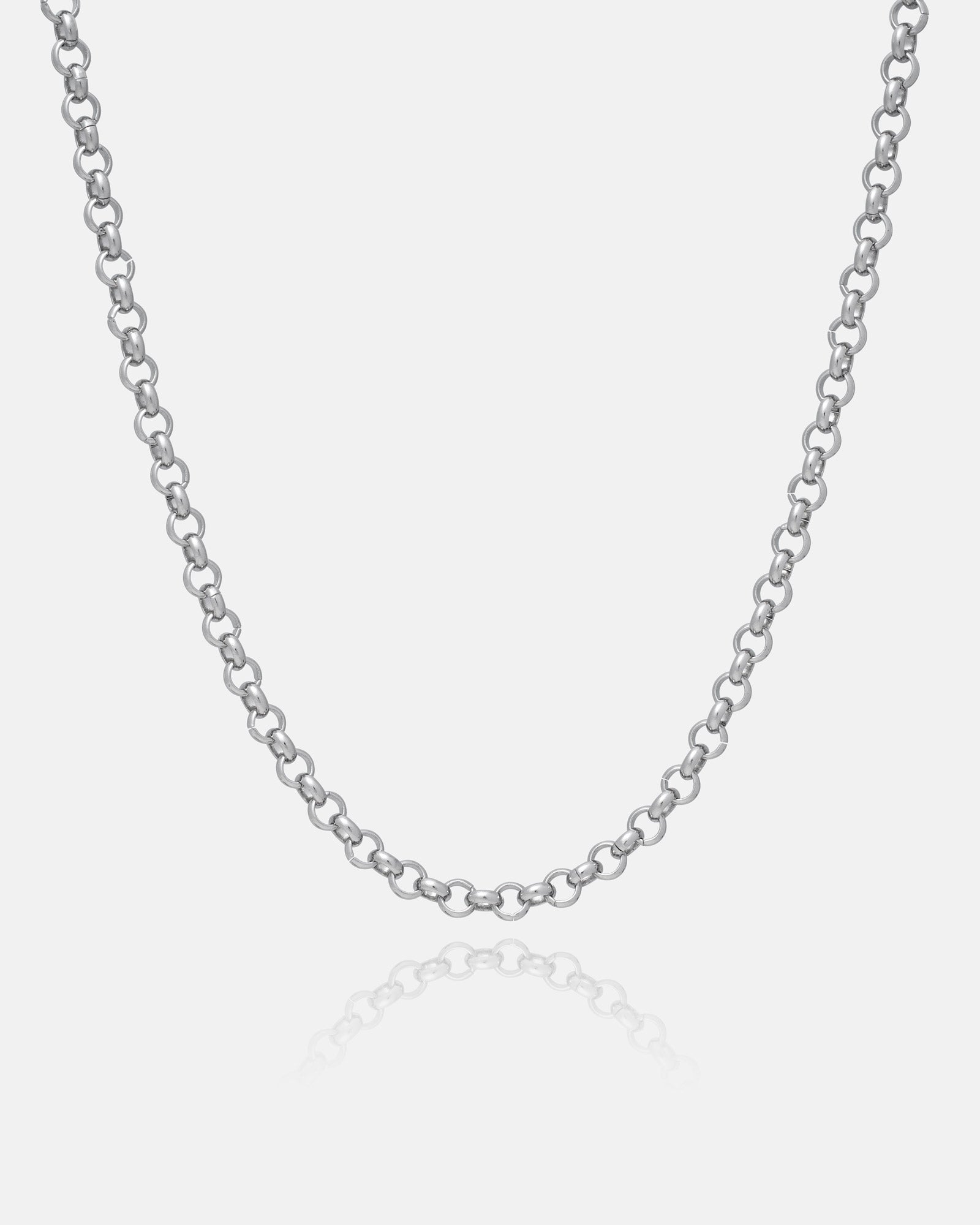 A close-up of the 5mm Rolo Chain, a non-tarnish stainless steel necklace with round links, displayed on a plain white background. The necklace curves gently, with a subtle reflection visible below.