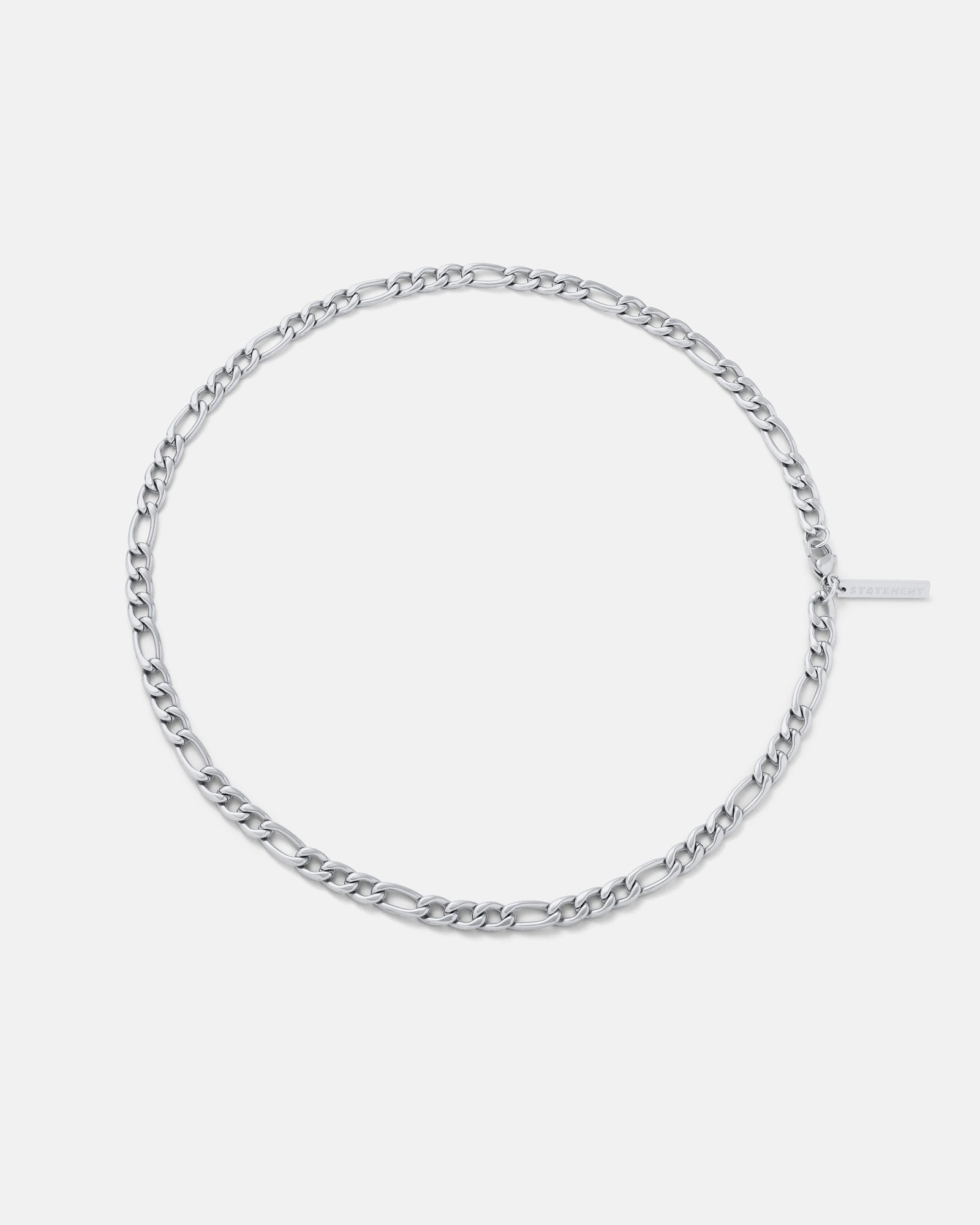 Silver chain bracelet on a light gray background