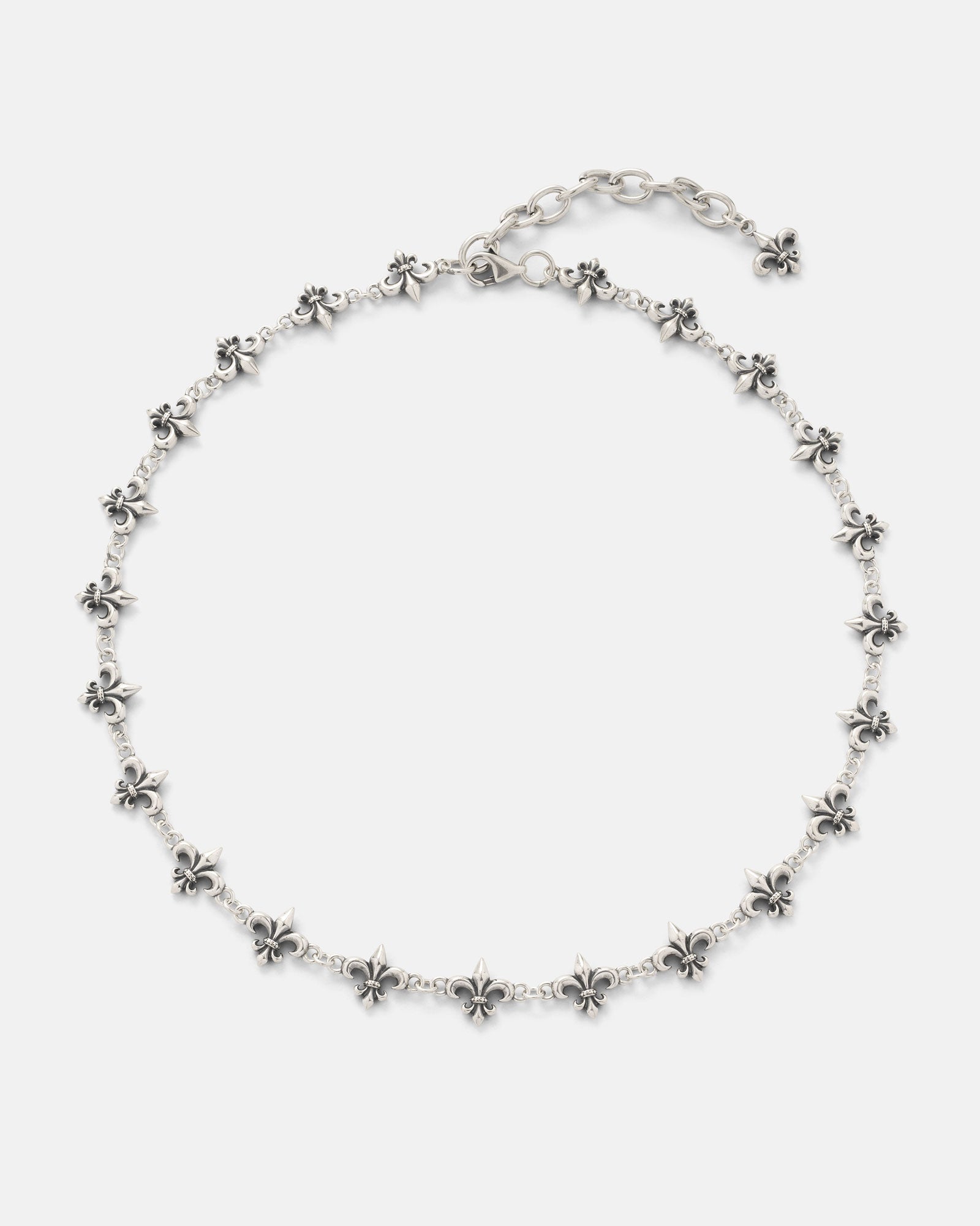 The 925 Sterling Silver "Fleur De Lis" 10mm Chain by Statement Collective showcases evenly spaced fleur-de-lis charms along a sterling silver chain and features an adjustable clasp finished with an additional fleur-de-lis charm at the end.