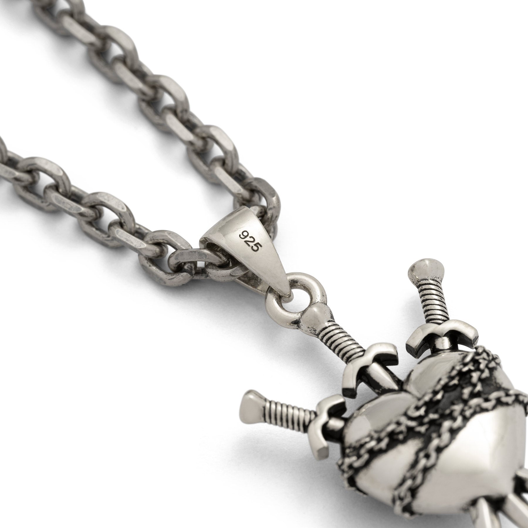 Silver heart pendant with 3 swords going through it and wrapped in chain engraved with "925" on the bail 
