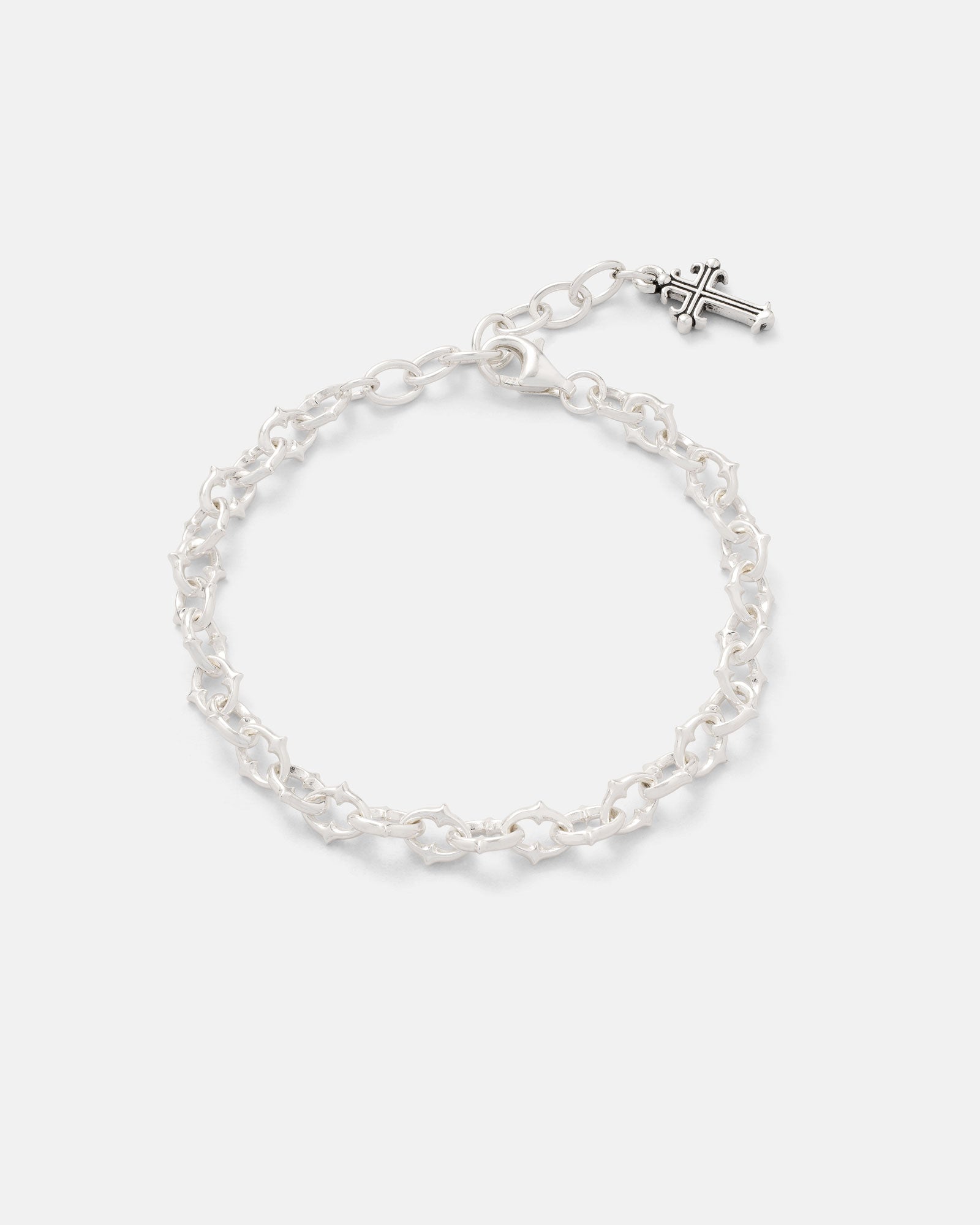 The Statement Collective 925 Sterling Silver "The Cathedral" 6mm Spiked Bracelet features distinctive spiked links and an adjustable chain, showcased against a plain white background.