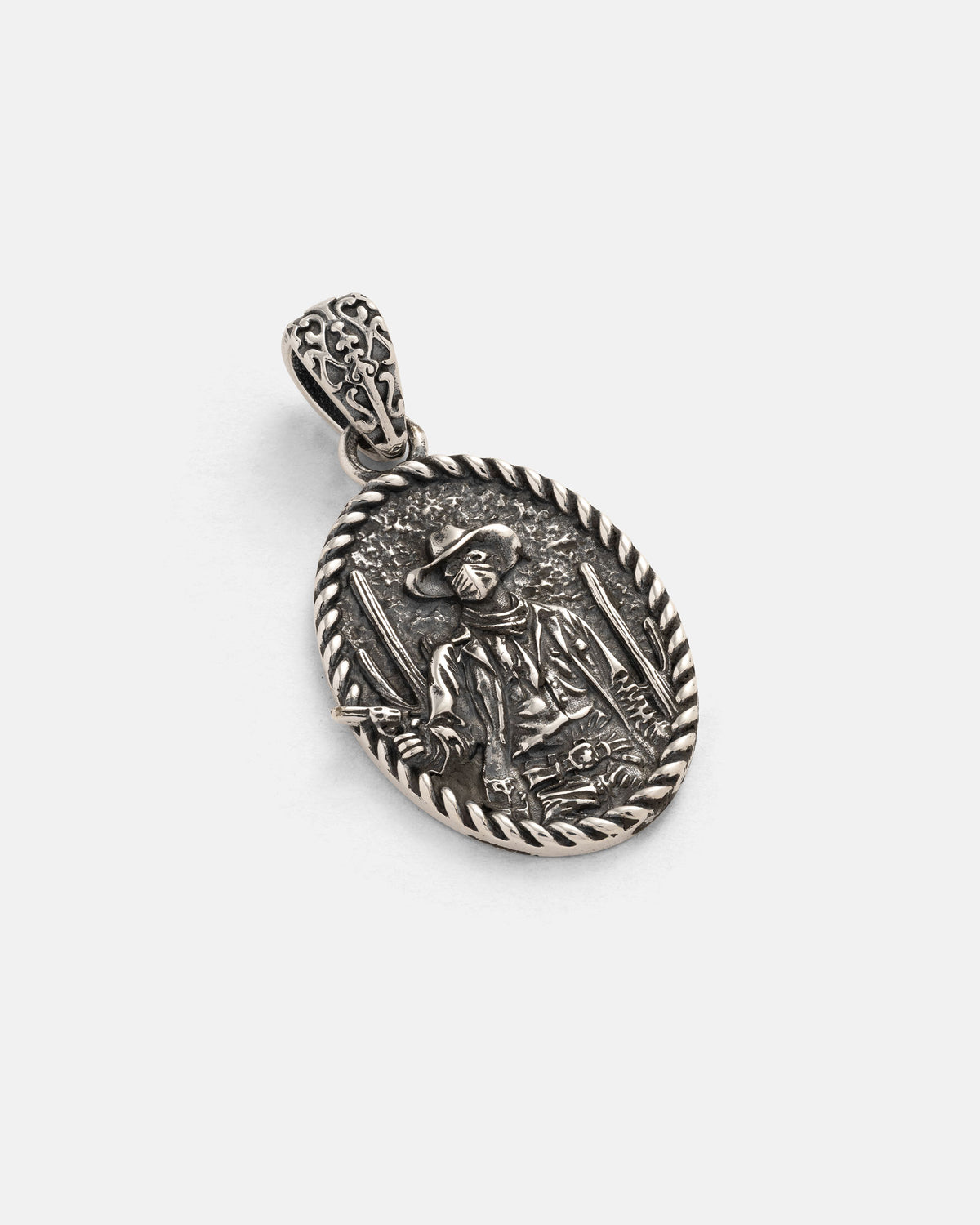 The 925 Sterling Silver "Big Iron" Pendant by Statement Collective features an oval design with a detailed engraving of a person wearing a hat and coat, holding two swords. Its edge is accented with a twisted rope-like border, while the bail boasts an ornate pattern, making this pendant a bold and striking addition to any punk metal jewelry collection.
