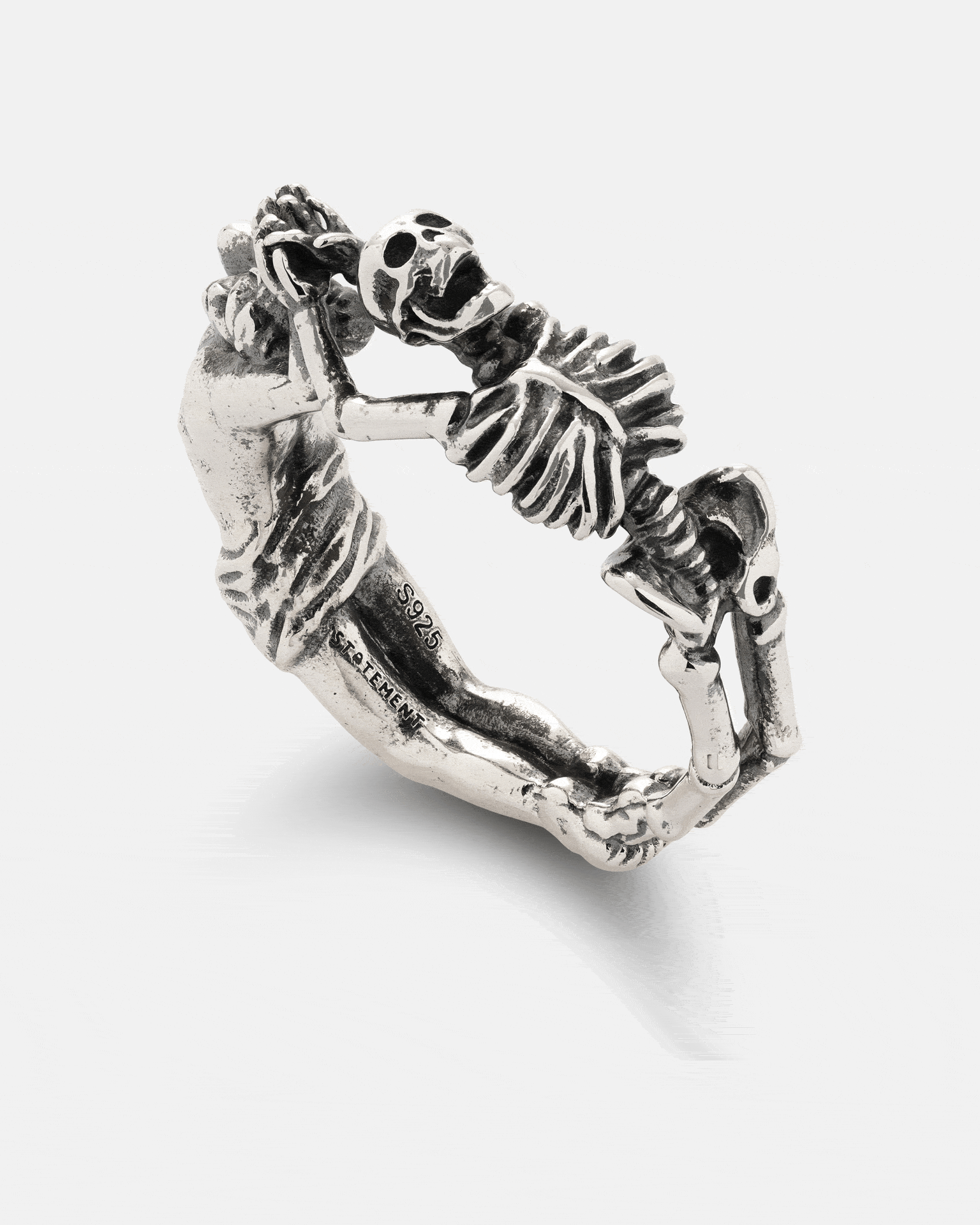 925 Sterling Silver Breaking Wheel Ring featuring a sterling silver Gothic macabre design with a sculpted figure and a skeleton facing each other.
