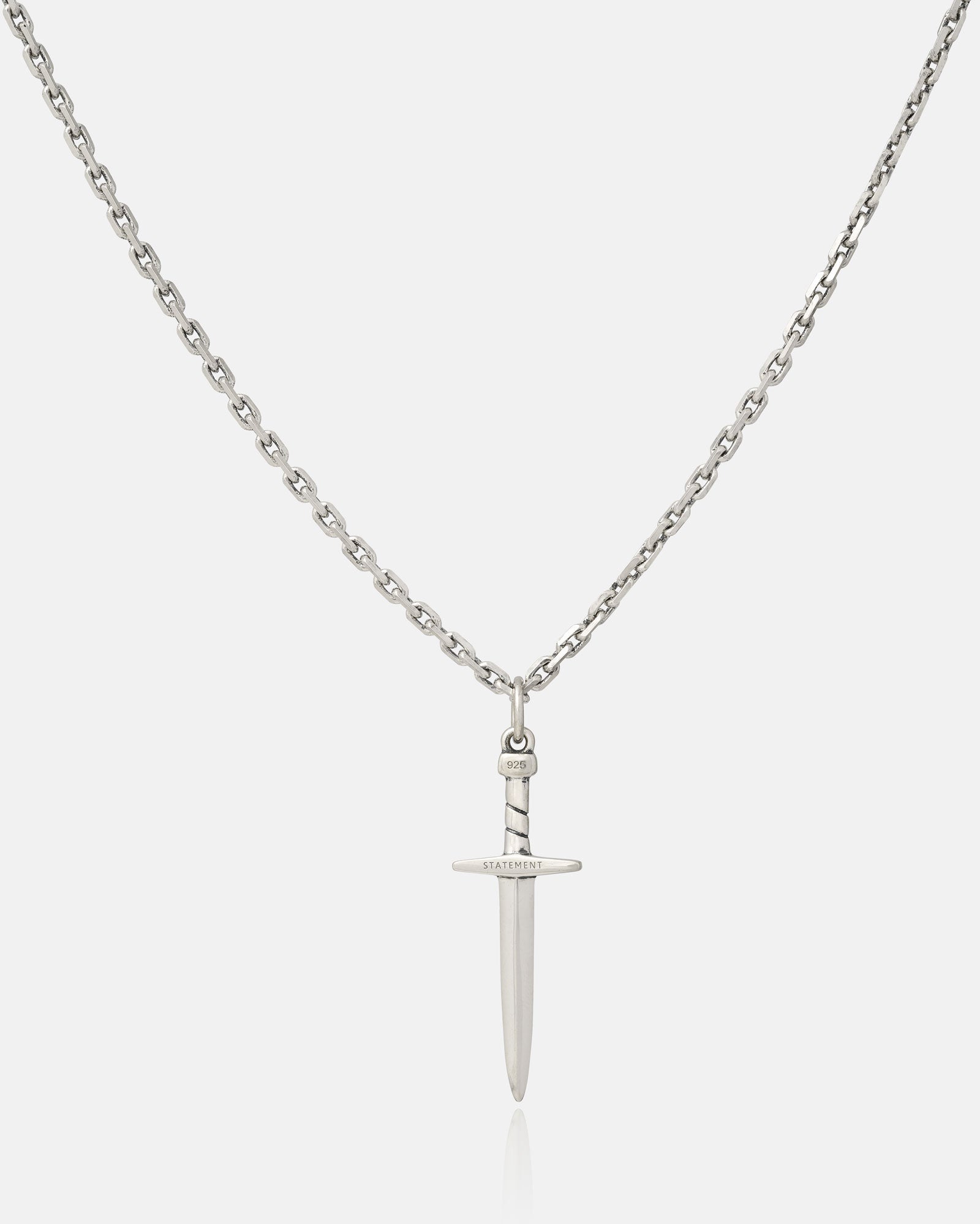 The 925 Sterling Silver Dagger Pendant is a handmade chain necklace featuring a detailed dagger charm engraved with “RADIATE” on the crossguard, displayed on a plain white background—an elegant sterling silver accessory.