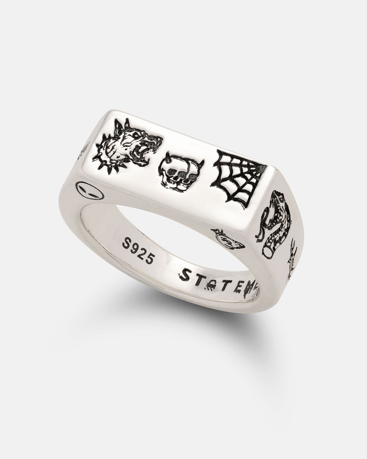 Introducing the 925 Sterling Silver Tattoo Signet Ring by Statement Collective—a bold statement piece featuring engraved patchwork tattoo designs of a wolf, skull, spider web, and alligator. Crafted from genuine 925 sterling silver, the inner band is stamped with S925 and STATEM for authenticity.