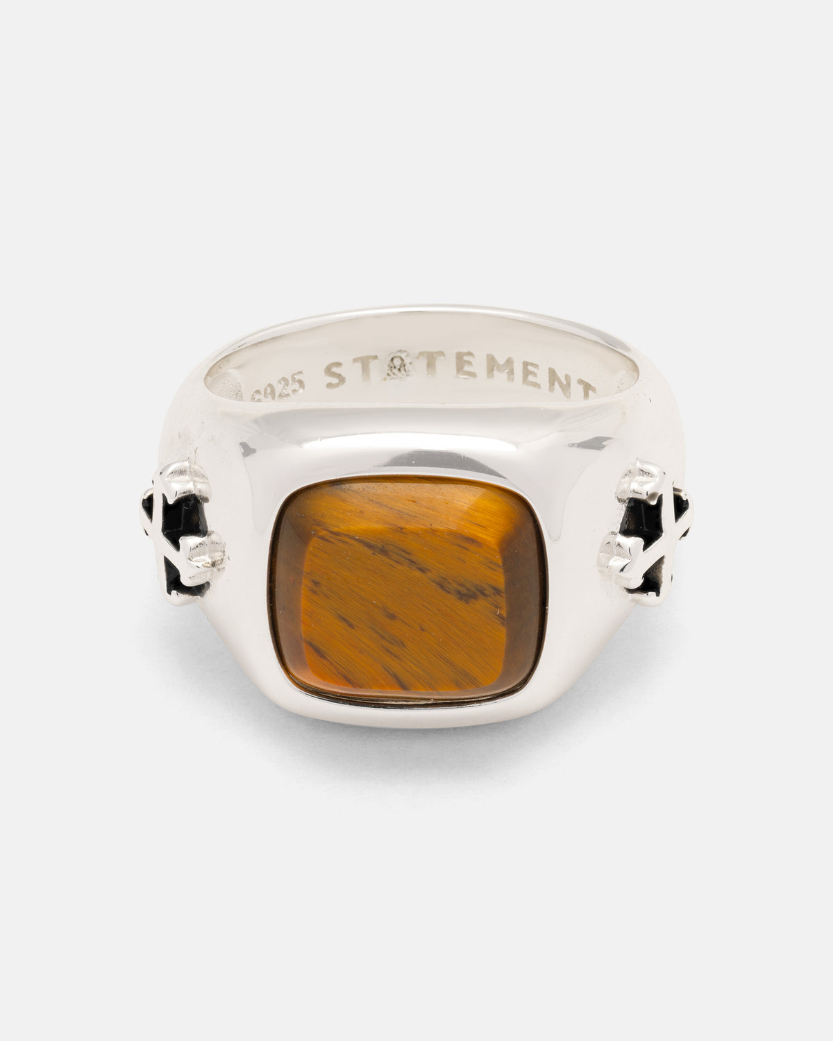 Statement Collective 925 Sterling Silver Tigers Eye Stone Ring in sterling silver with a square tiger’s eye stone, featuring tattoo-inspired cross-shaped details on the sides and an engraved interior.