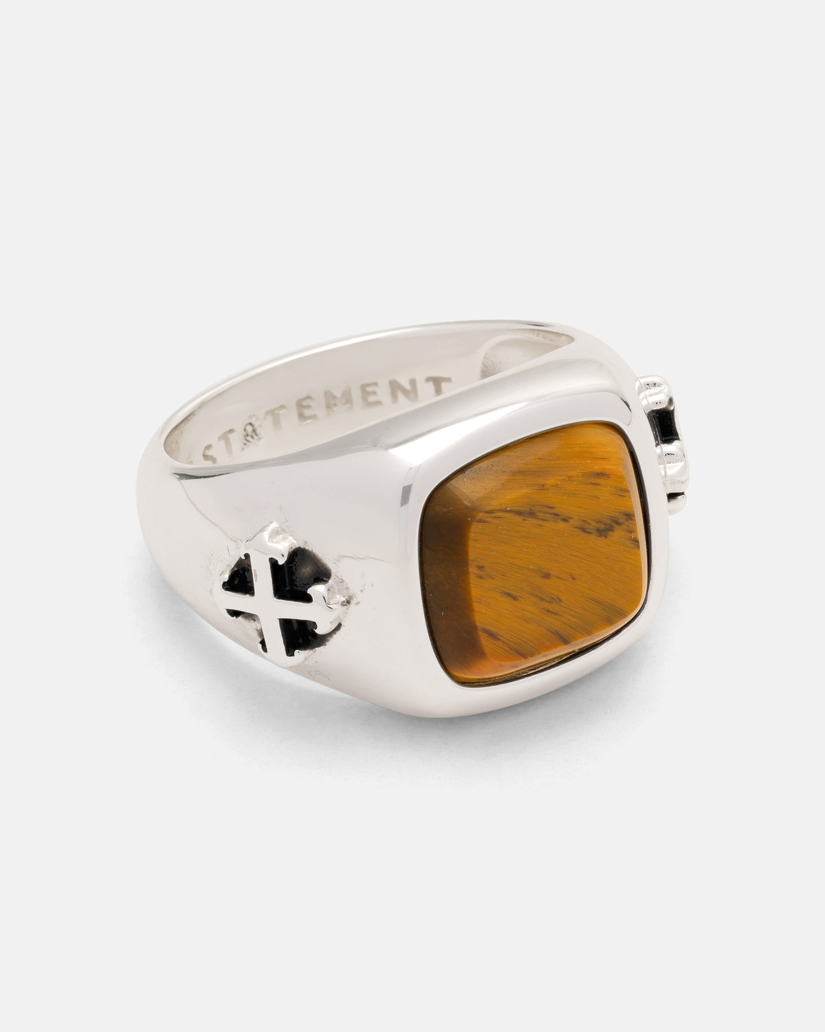 Statement Collective 925 Sterling Silver Tigers Eye Stone Ring featuring a rectangular tiger’s eye stone and a tattoo-inspired cross emblem on the side.