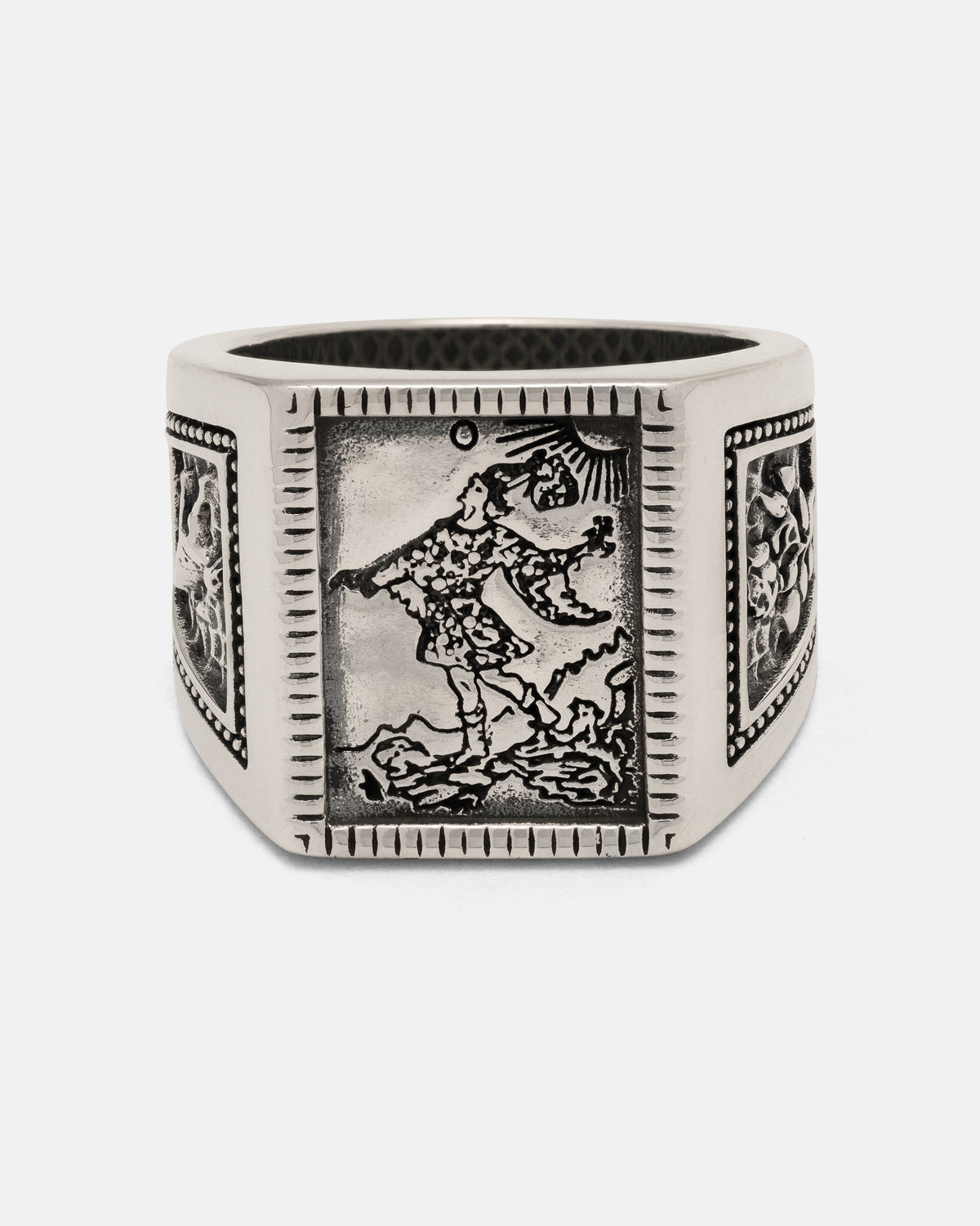 Statement Collective 925 Sterling Silver Try Hard Fool signet ring featuring an engraved rectangular panel of a person walking under a sun, framed by decorative border patterns.