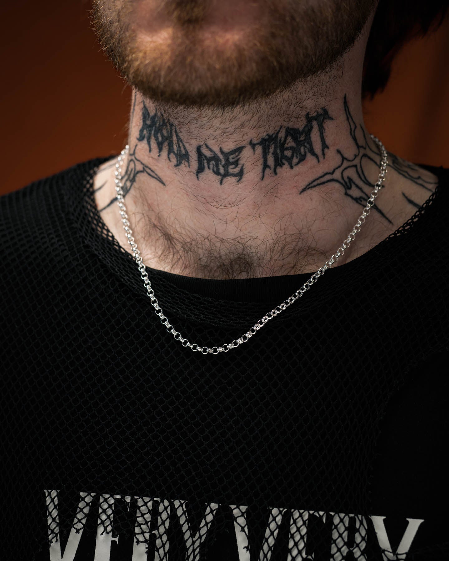 sterling silver rolo chain with 4mm links on tattooed model's neck