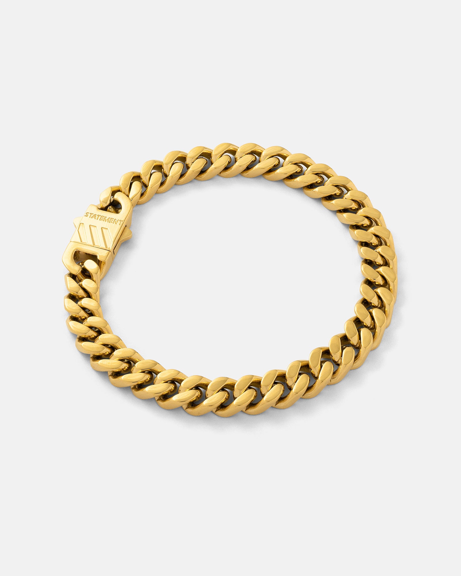 Gold 9mm cuban bracelet by statement collective on grey background 