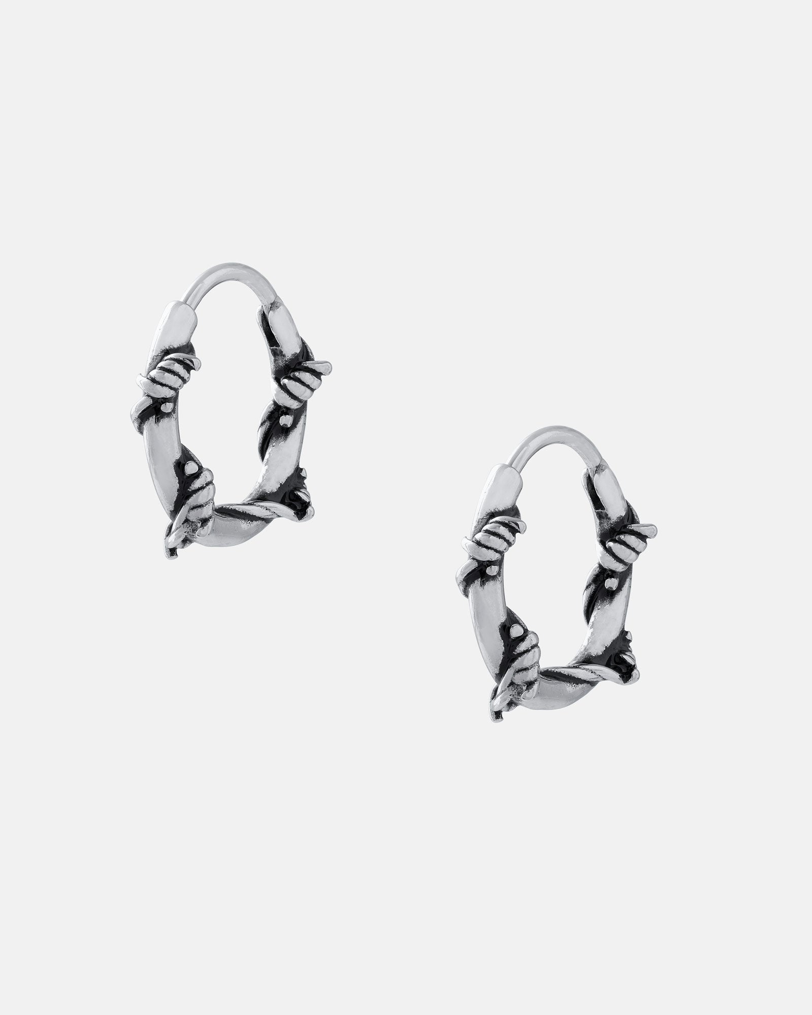 Barbed Wire Hoop Earrings made of hypoallergenic stainless steel, shown on a plain light gray background.
