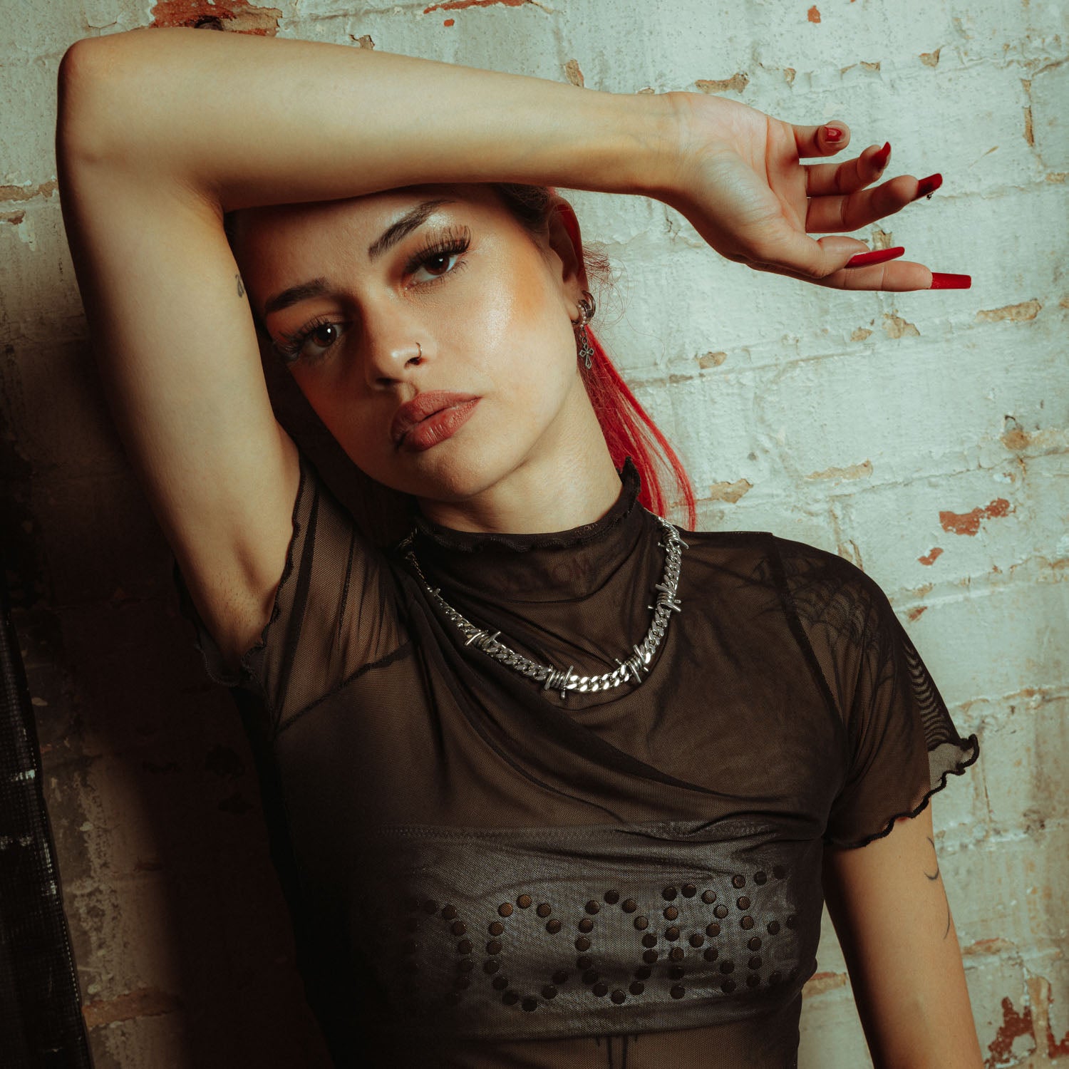 Sterling Silver 9mm Barbed wire chain on female model with mesh shirt and red hair 