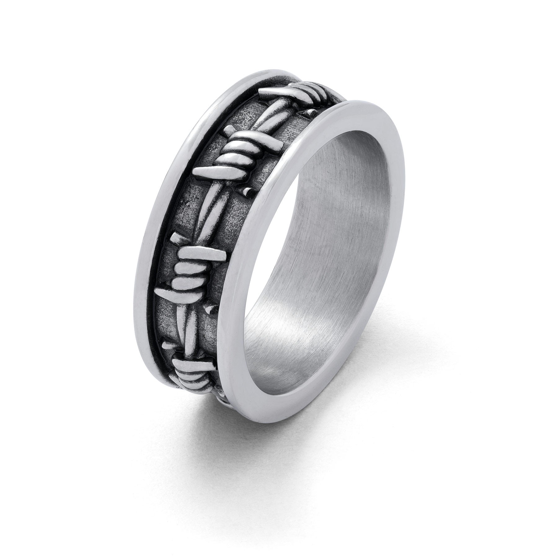 Silver ring with barbed wire details around entire ring.