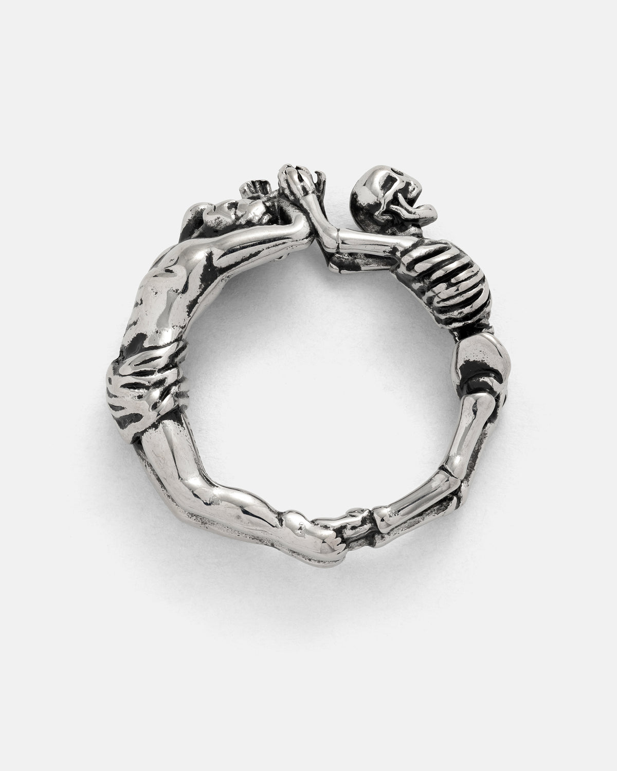 Silver Breaking Wheel ring shaped like two figures forming a circle, one with a skeletal torso and skull and the other with a muscular physique.