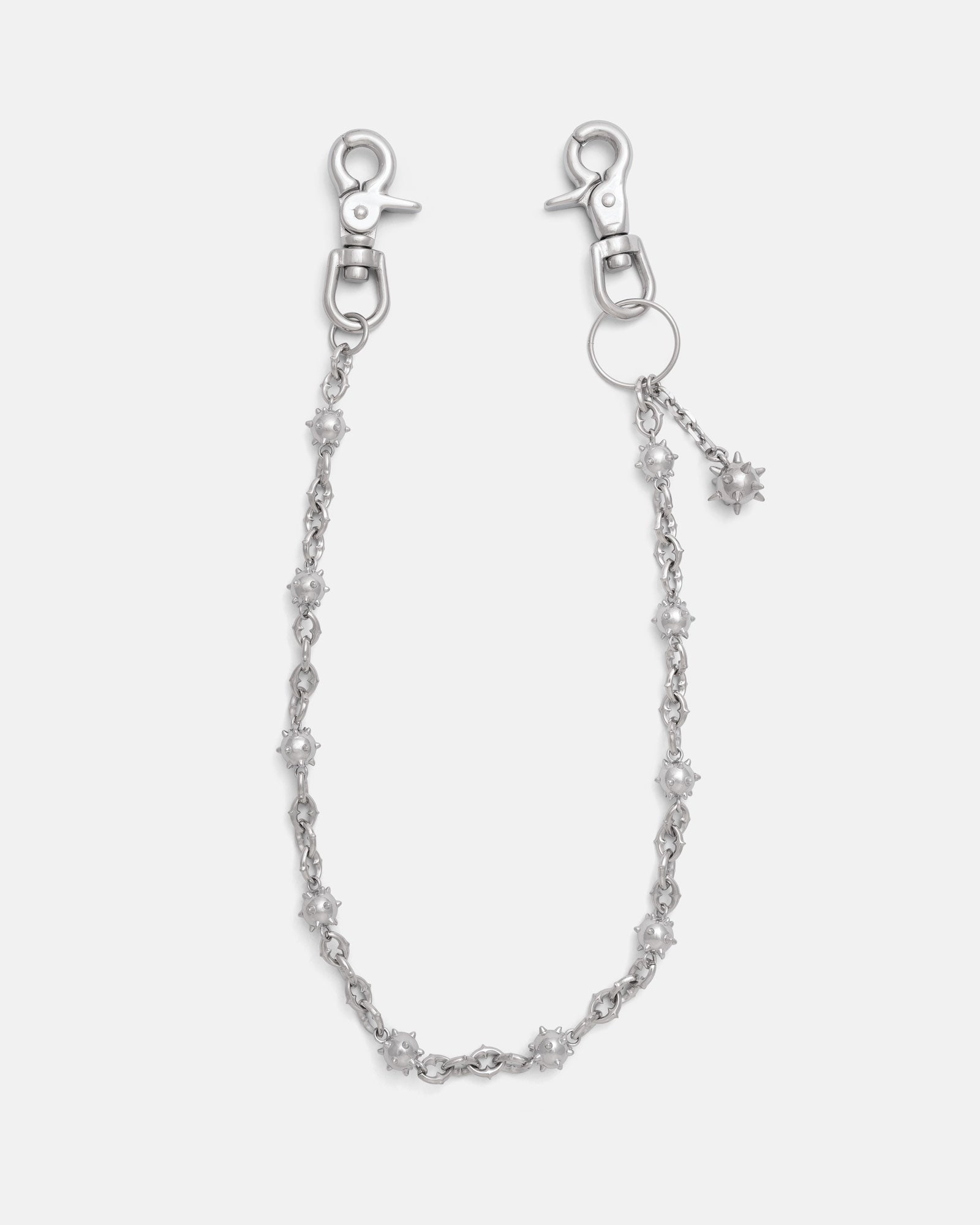 Silver spiked chain link wallet chain with spiked mase balls throughout, including an extra dangling spiked mase ball charm. Silver heavy duty hardware clips to hook onto you belt loops. on grey background.