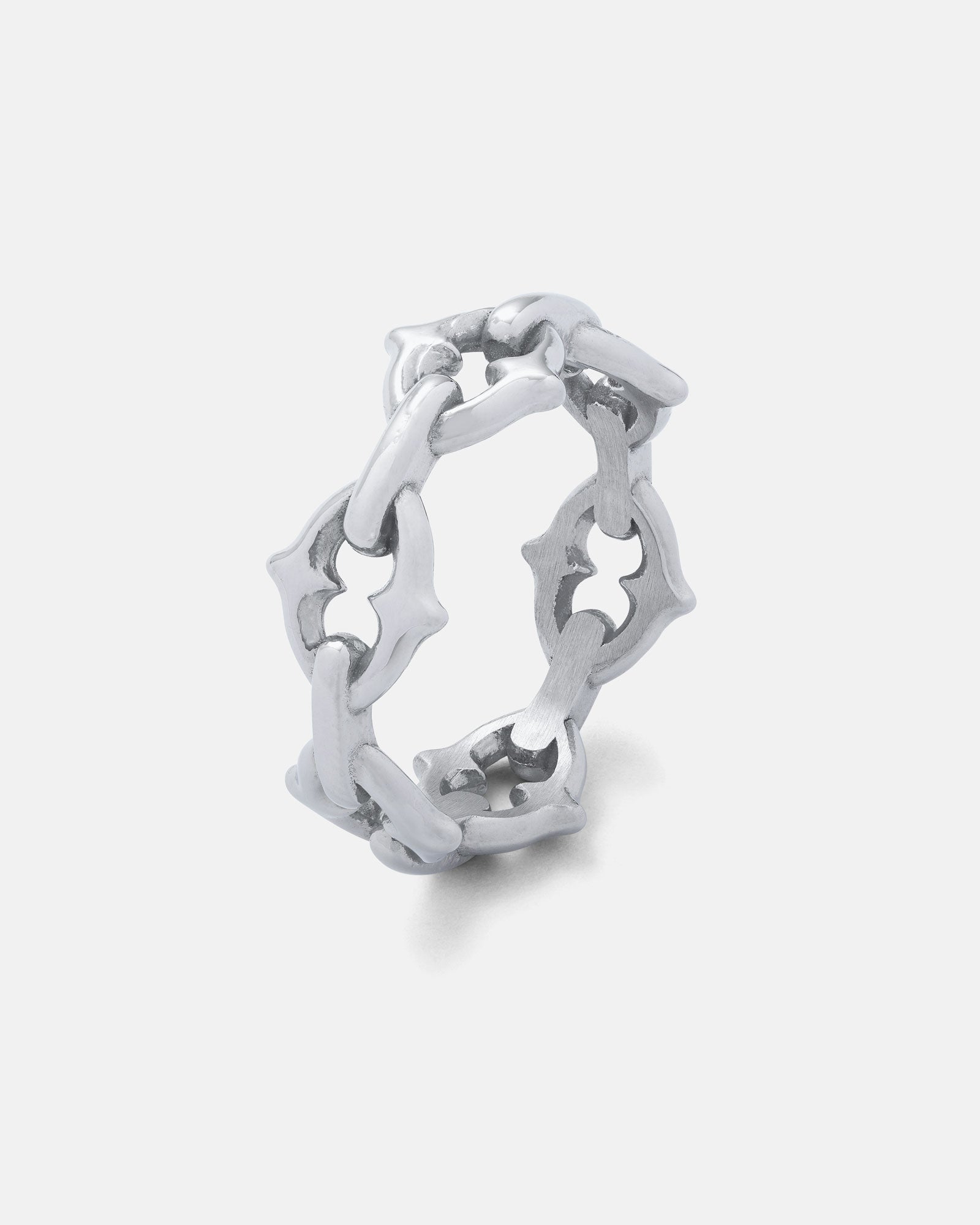 The Cathedral" Spiked Ring showcases gothic, interconnected chain links with star-shaped cutout details, presented on a plain white background.