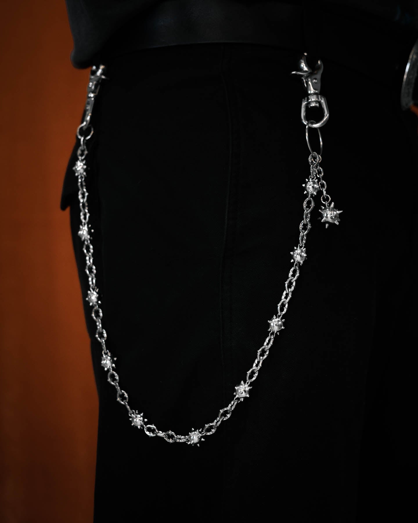 spiked mace ball wallet chain with medieval chain links on model with black pants