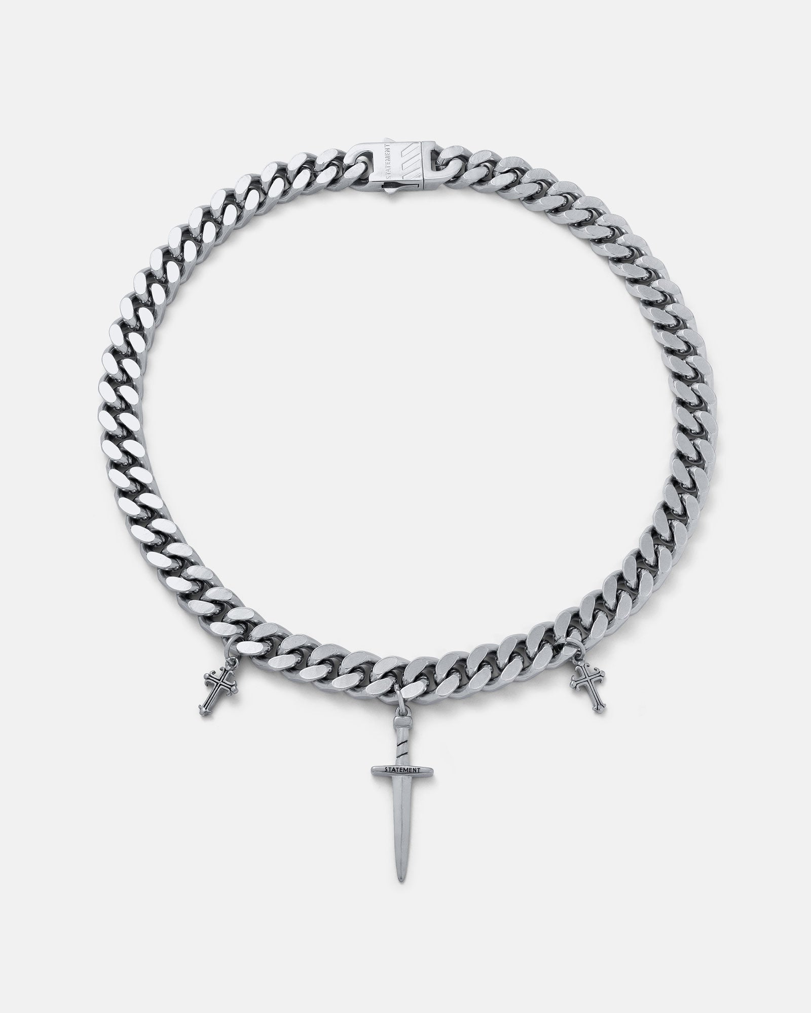Silver chain necklace with a central dagger pendant on a grey background