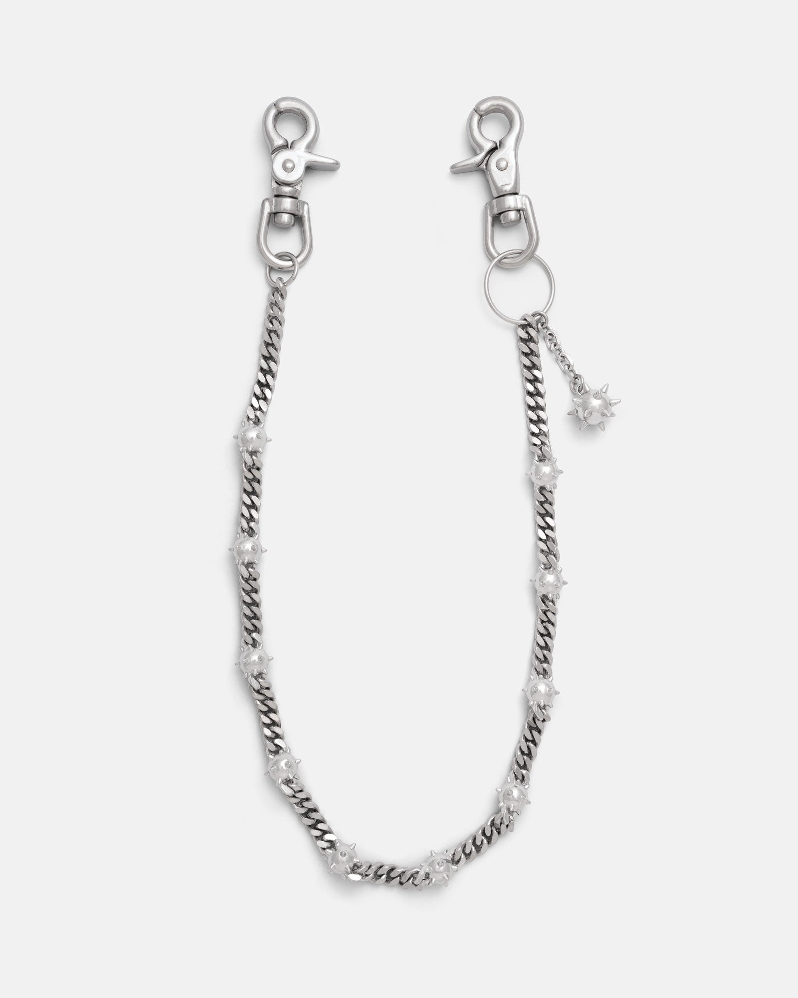 Silver Cuban link wallet chain with spiked mase balls throughout, including an extra dangling spiked mase ball charm. Silver heavy duty hardware clips to hook onto you belt loops. on grey background.