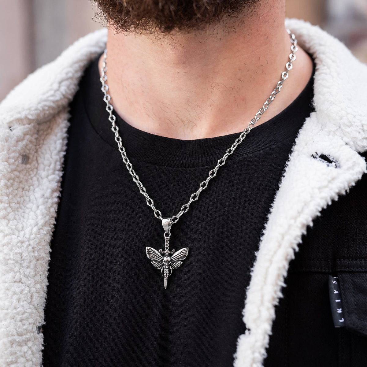 moth pendant with wings by statement collective