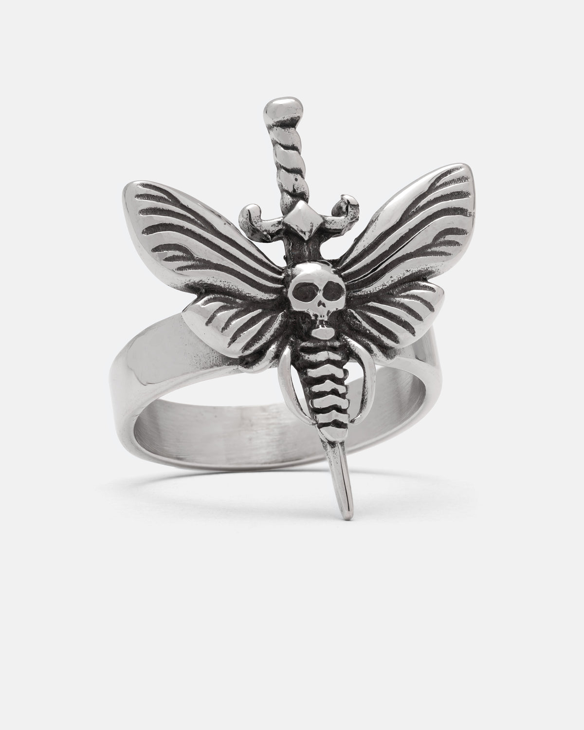 A stainless steel Death’s Head Moth Ring by Statement Collective featuring a moth with a skull on its thorax, centered on a dagger blade.