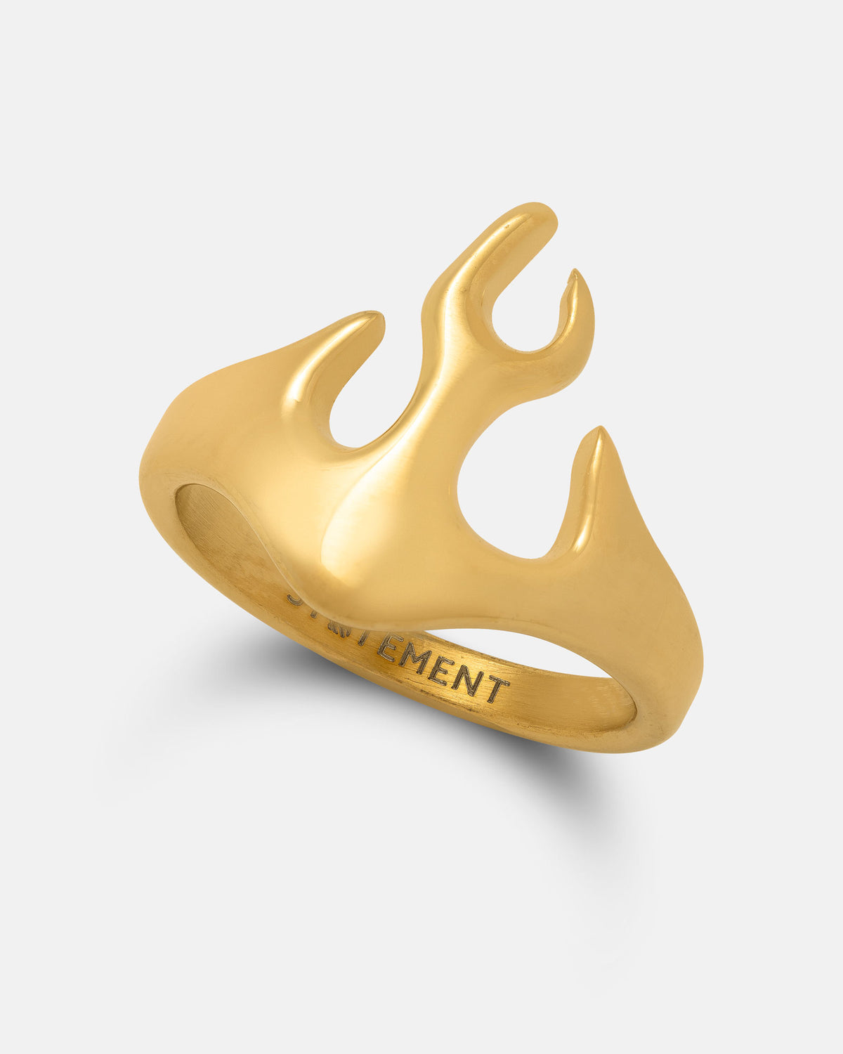 The Flame Ring (Gold) by Statement Collective is a striking piece of gold statement jewelry, crafted in lustrous 18k gold with an abstract flame-shaped design featuring smooth curves. The inner band is engraved with text, and the ring is presented against a plain, light gray background.