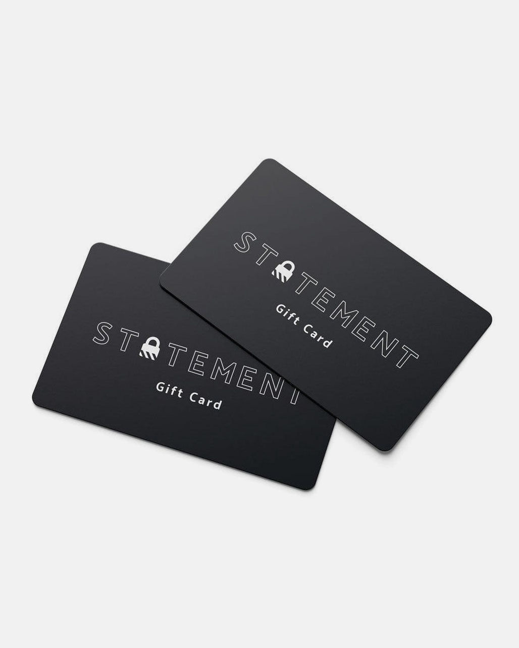 Two black Statement Collective Gift Cards with white text, slightly overlapping on a white background. The perfect way to give the gift of choice.