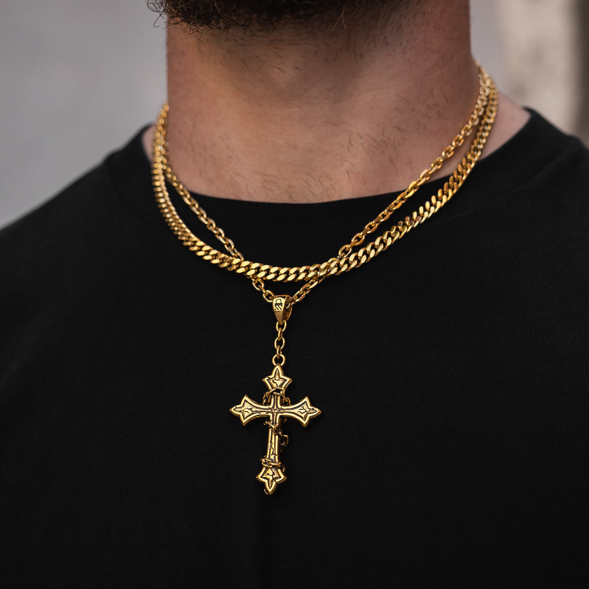 gold cross necklace set by statement collective