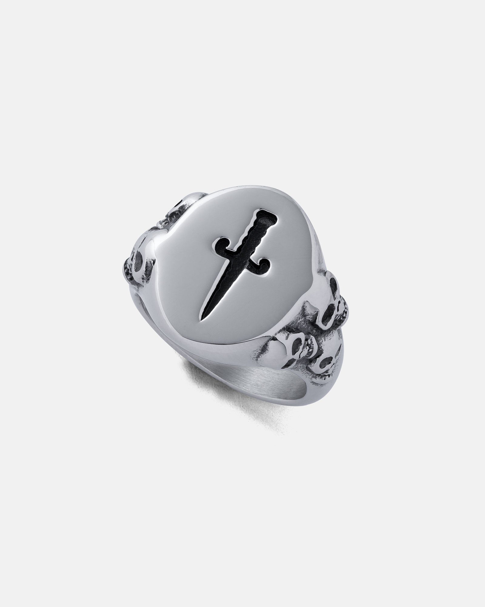 Silver ring with a sword symbol on a light gray background by statement collective